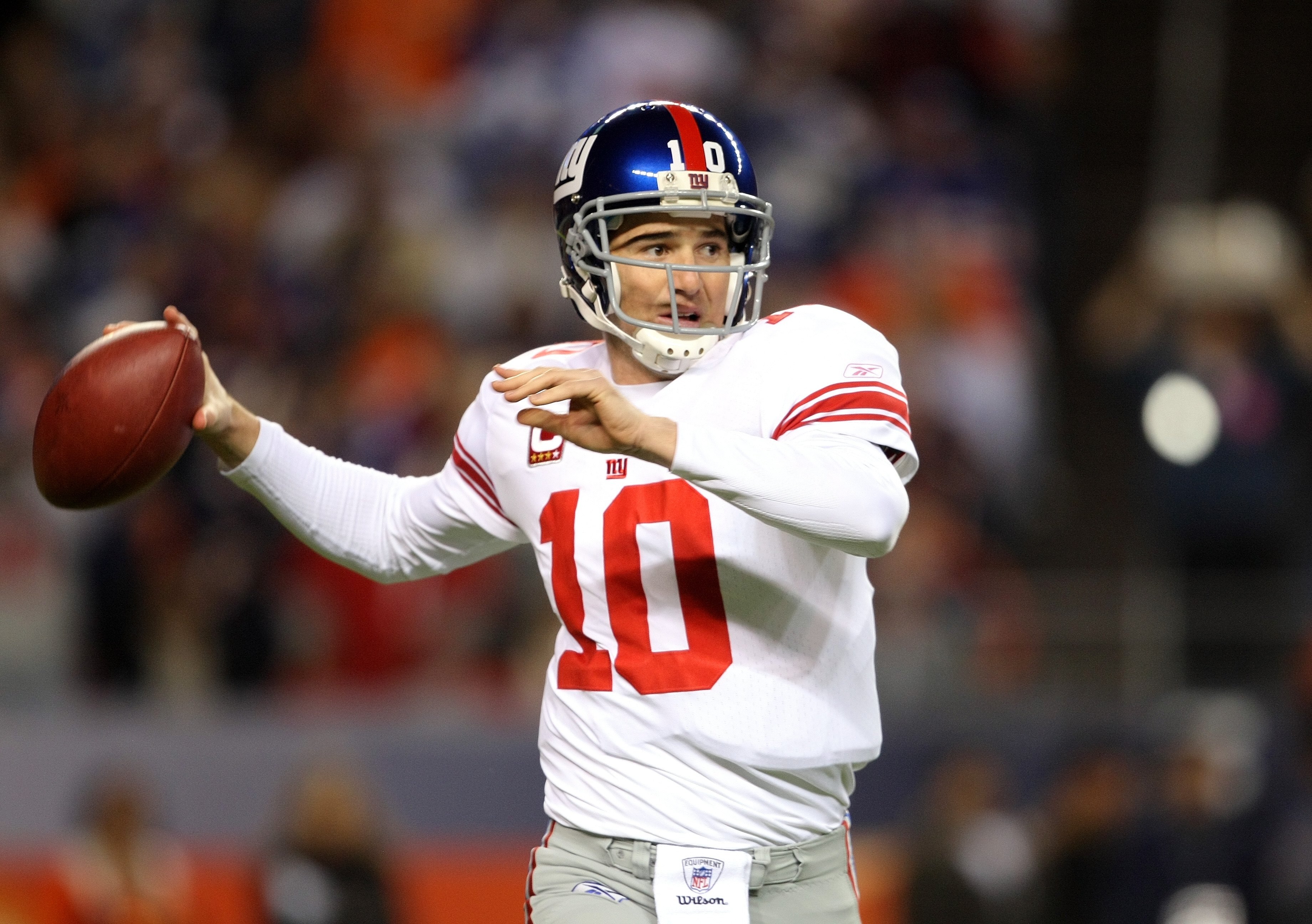 DENVER - NOVEMBER 26: Quarterback Eli Manning #10 of the New York Giants delivers a pass against the Denver Broncos during NFL action at Invesco Field at Mile High on November 26, 2009 in Denver, Colorado. The Broncos defeated the Giants 26-6. (Photo by DENVER - NOVEMBER 26: Quarterback Eli Manning #10 of the New York Giants delivers a pass against the Denver Broncos during NFL action at Invesco Field at Mile High on November 26, 2009 in Denver, Colorado. The Broncos defeated the Giants 26-6. (Photo by