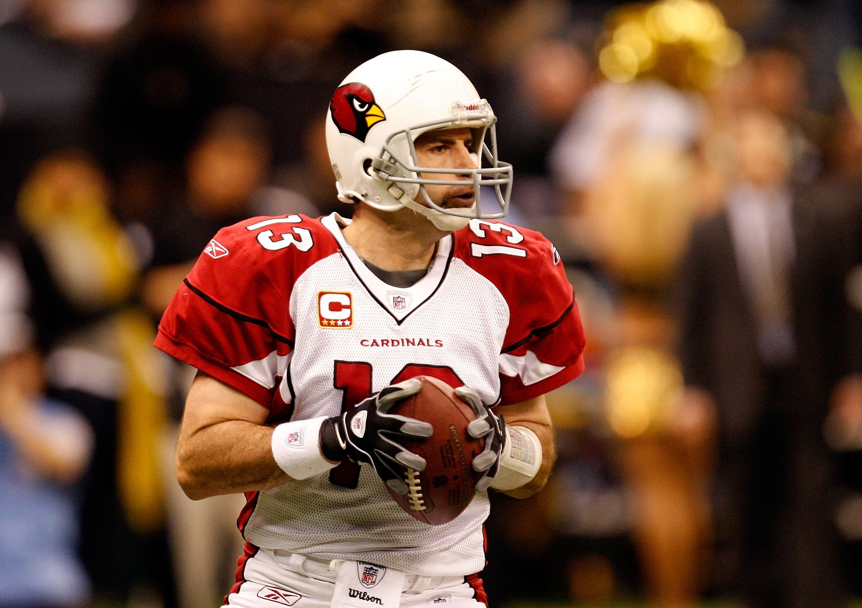 NEW ORLEANS - JANUARY 16:  Quarterback Kurt Warner #13 of the Arizona Cardinals looks to pass against the New Orleans Saints during the NFC Divisional Playoff Game at Louisana Superdome on January 16, 2010 in New Orleans, Louisiana. The Saints won 45-14. 