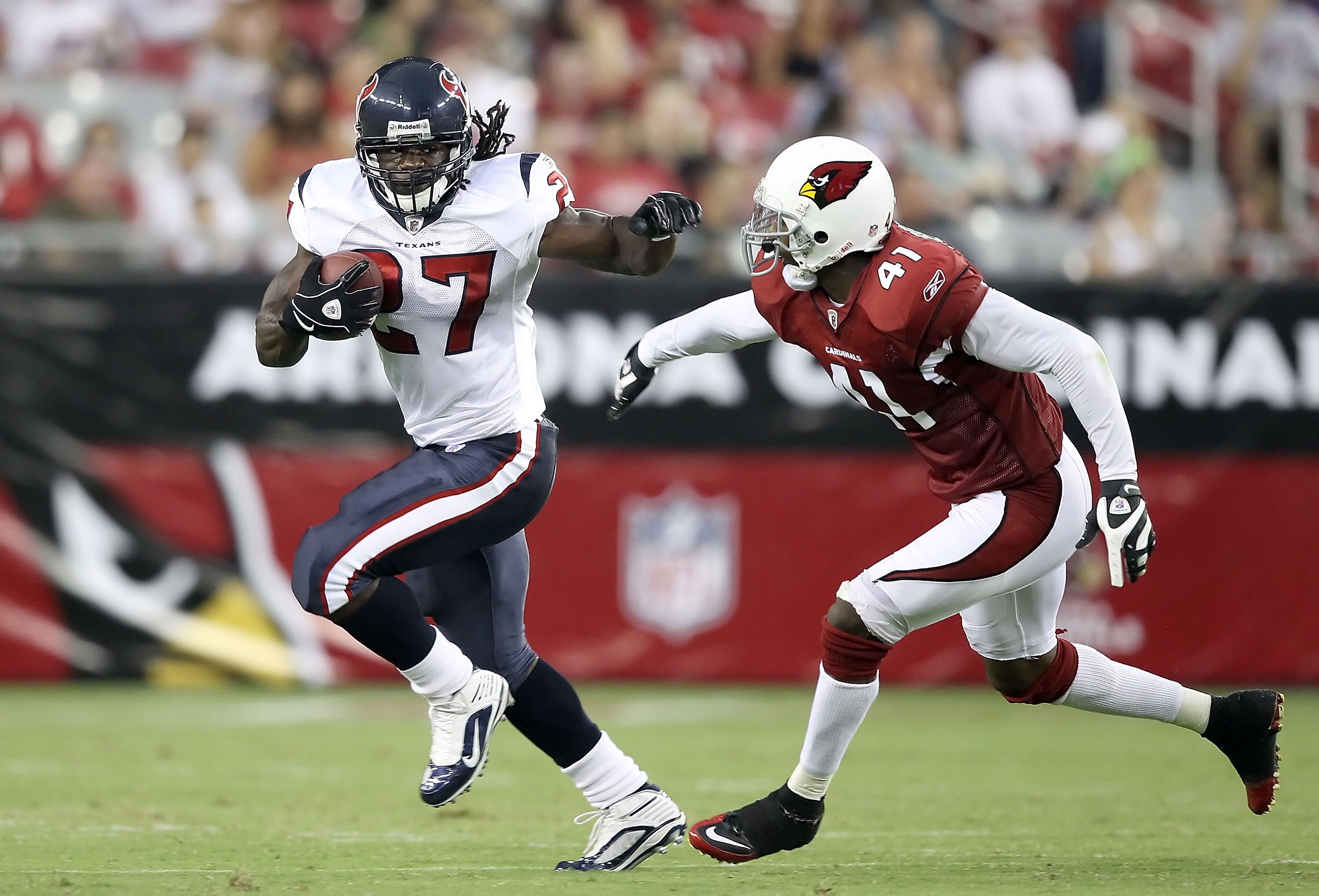 GLENDALE, AZ - AUGUST 14:  Runningback Chris Henry #27 of the Houston Texans rushes the ball past Hamza Abdullah #41 of the Arizona Cardinals during preseason NFL game at the University of Phoenix Stadium on August 14, 2010 in Glendale, Arizona. The Cardi