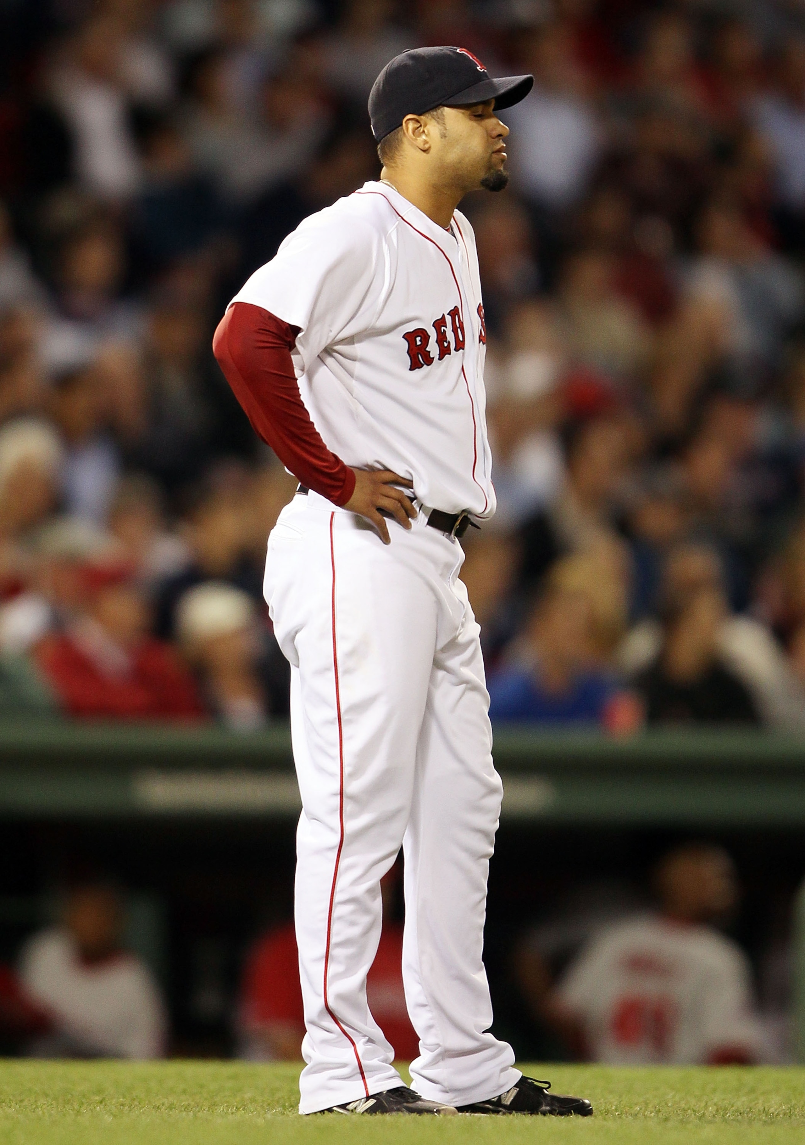 BOSTON - MAY 06:  Manny Delcarmen #17 of the Boston Red Sox reacts after Mike Napoli of the Los Angeles Angels of Anaheim hits a two run homer in the sixth inning on May 6, 2010 at Fenway Park in Boston, Massachusetts.  (Photo by Elsa/Getty Images)