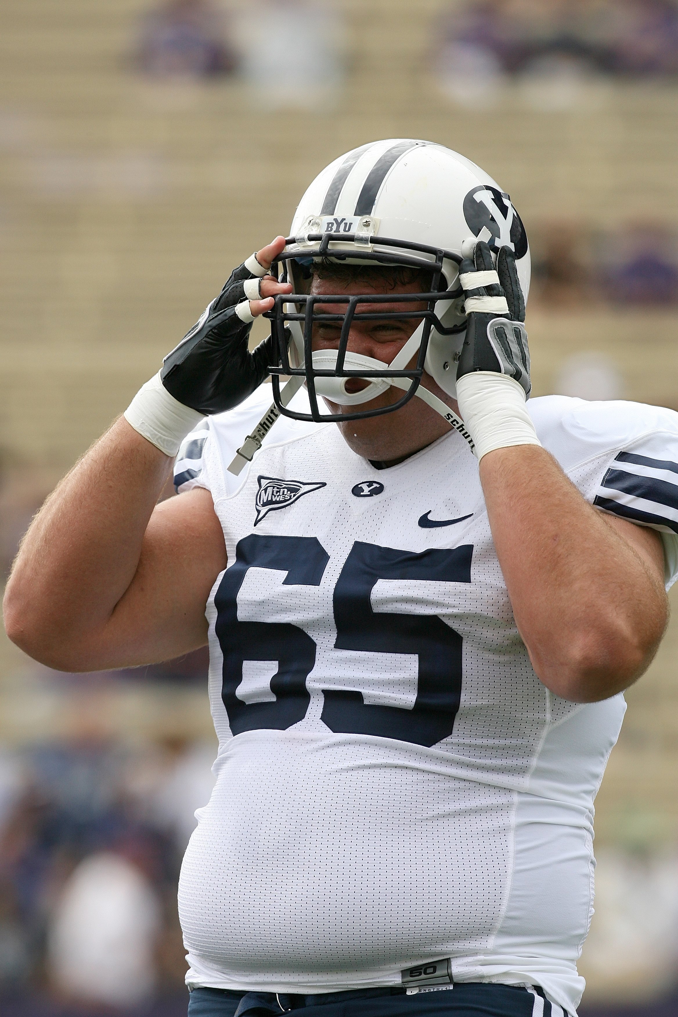 SEATTLE - SEPTEMBER 6:  Dallas Reynolds #65 of the BYU Cougars warms up prior to their game against the Washington Huskies on September 6, 2008 at Husky Stadium in Seattle, Washington. The Cougars defeated the Huskies 28-27. (Photo by Otto Greule Jr/Getty
