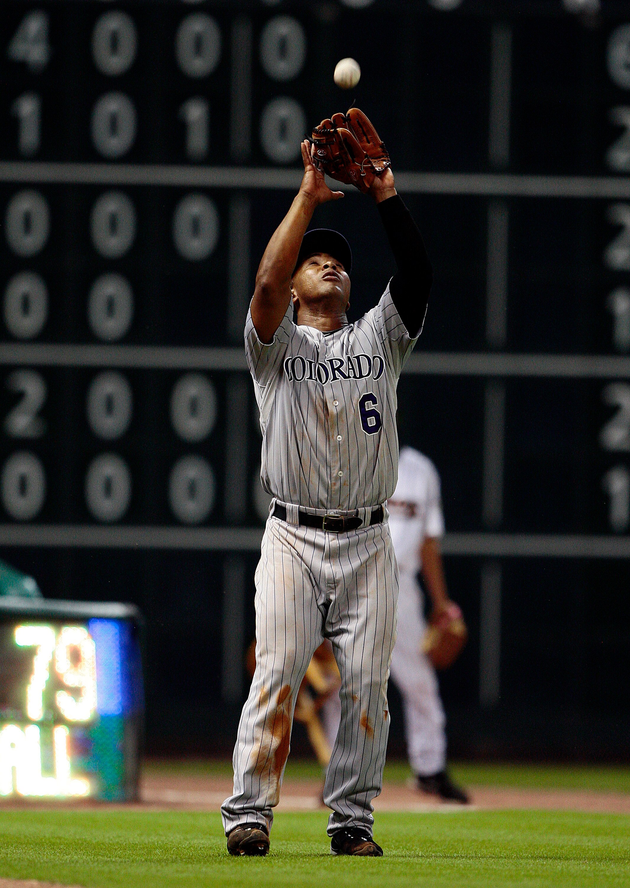 HOUSTON - MAY 19:  Third baseman Melvin Mora #6 of the Colorado Rockies makes a catch in foul territory against the Houston Astros at Minute Maid Park on May 19, 2010 in Houston, Texas.  (Photo by Bob Levey/Getty Images)