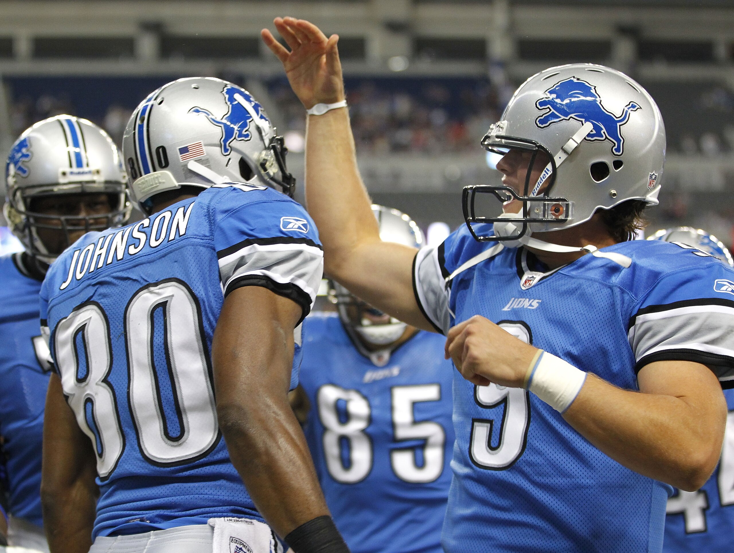 DETROIT - AUGUST 28:  Bryant Johnson #80 of the Detroit Lions celebrates a first quarter touchdown with Matthew Stafford #9 of the Cleveland Browns during a preseason game on August 28, 2010 at Ford Field in Detroit, Michigan.  (Photo by Gregory Shamus/Ge
