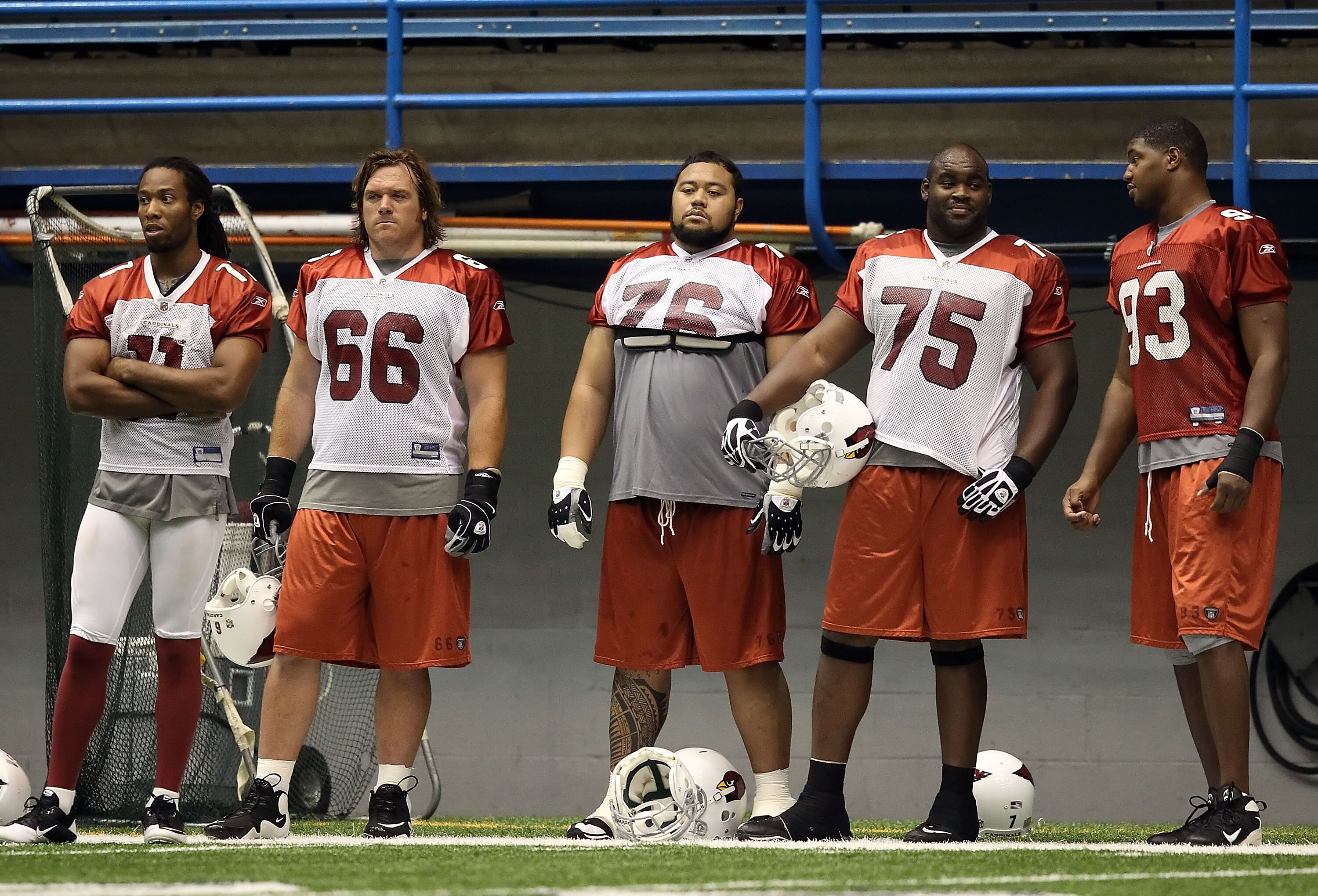 FLAGSTAFF, AZ - AUGUST 02:  (L-R) Larry Fitzgerald #11, Alan Faneca #66, Deuce Lutui #76, Levi Brown #75 and Dan Williams #93 of the Arizona Cardinals practice in the team training camp at Northern Arizona University Walkup Skydome on August 2, 2010 in Fl