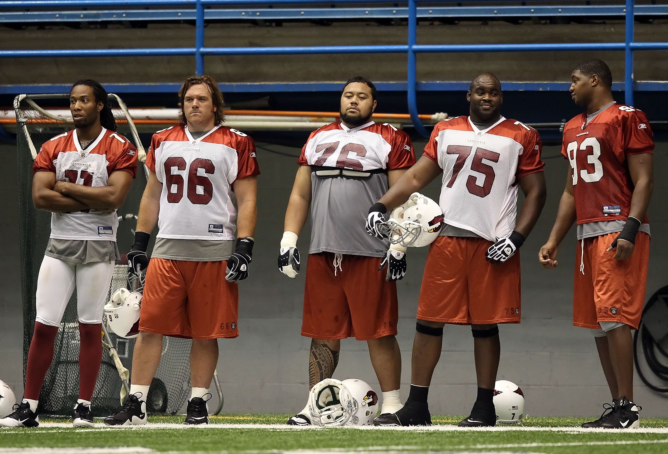 FLAGSTAFF, AZ - AUGUST 02:  (L-R) Larry Fitzgerald #11, Alan Faneca #66, Deuce Lutui #76, Levi Brown #75 and Dan Williams #93 of the Arizona Cardinals practice in the team training camp at Northern Arizona University Walkup Skydome on August 2, 2010 in Fl