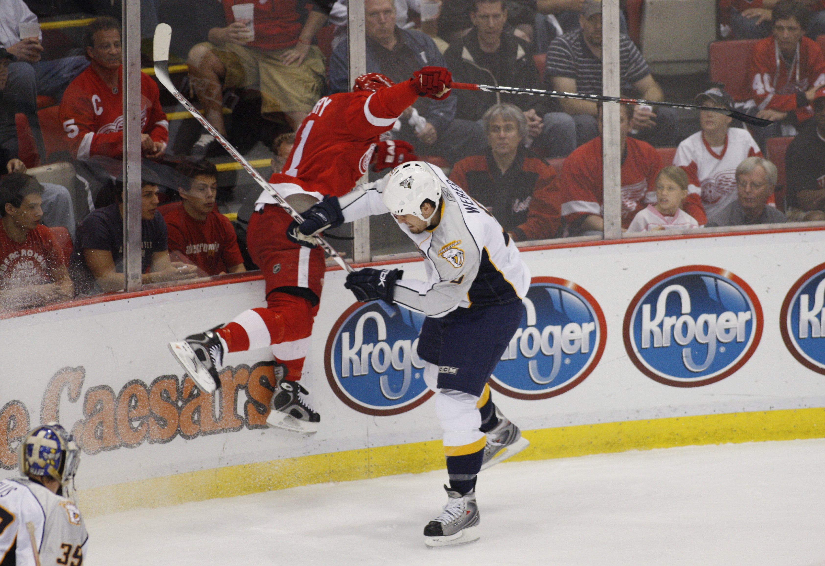 DETROIT - APRIL 18:  Shea Weber #6 of the Nashville Predators checks Dan Cleary #11 of the Detroit Red Wings against the boards during game five of the 2008 NHL Stanley Cup Playoffs Western Conference Quarterfinals on April 18, 2008 at Joe Louis Arena in
