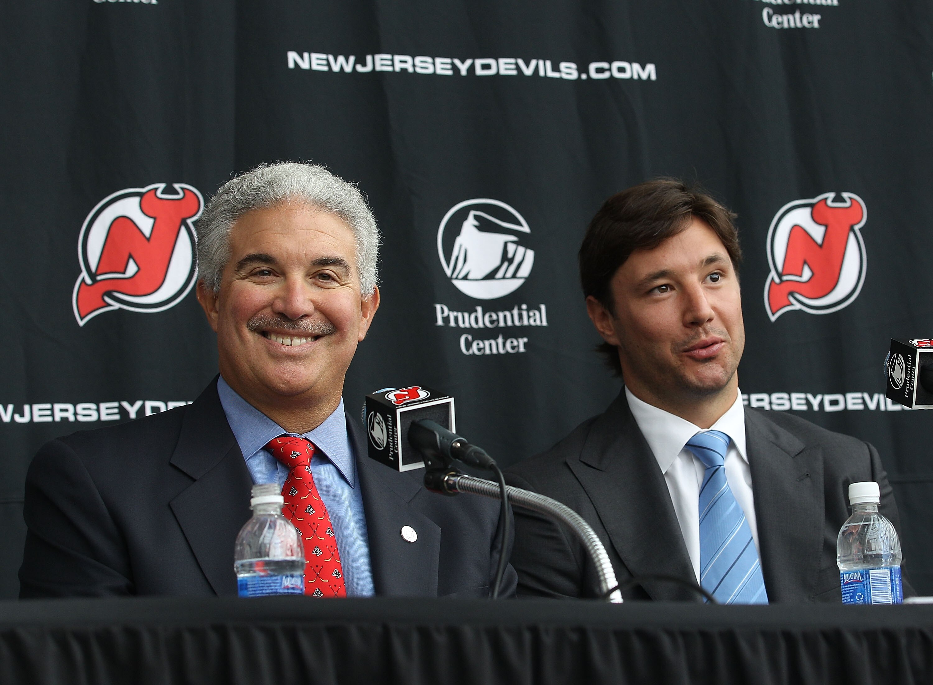 NEWARK, NJ - JULY 20: Team owner Jeff Vanderbeek and Ilya Kovalchuk of the New Jersey Devils field questions during a media opportunity announcing Kovalchuk's contract renewal at the Prudential Center on July 20, 2010 in Newark, New Jersey. (Photo by Bruc