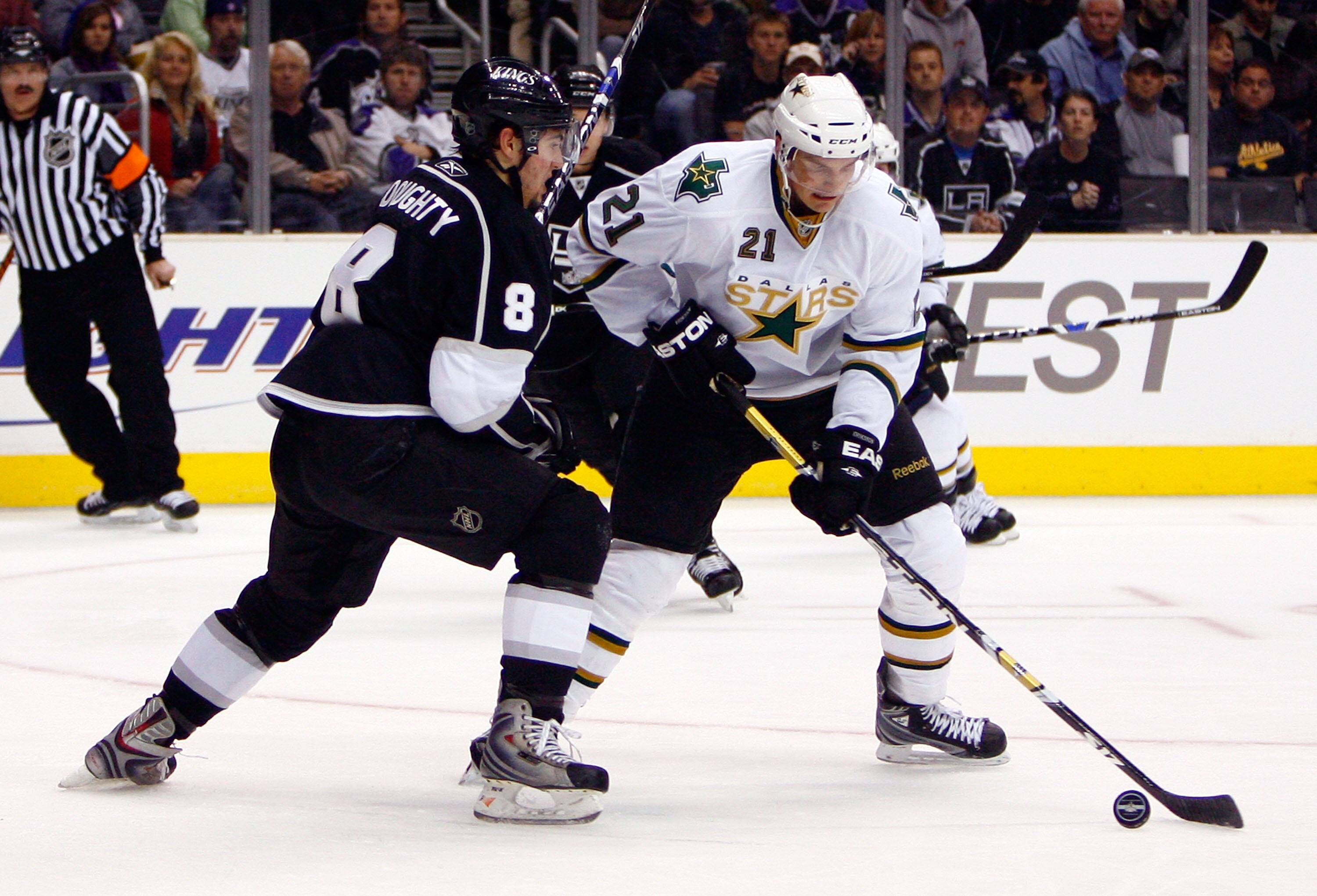 LOS ANGELES, CA - MARCH 31:  Loui Eriksson #21 of the Dallas Stars is pressured by Drew Doughty #8 of the Los Angeles Kings during the first period at Staples Center on March 31, 2009 in Los Angeles, California.  The Stars defeated the Kings 3-2.  (Photo