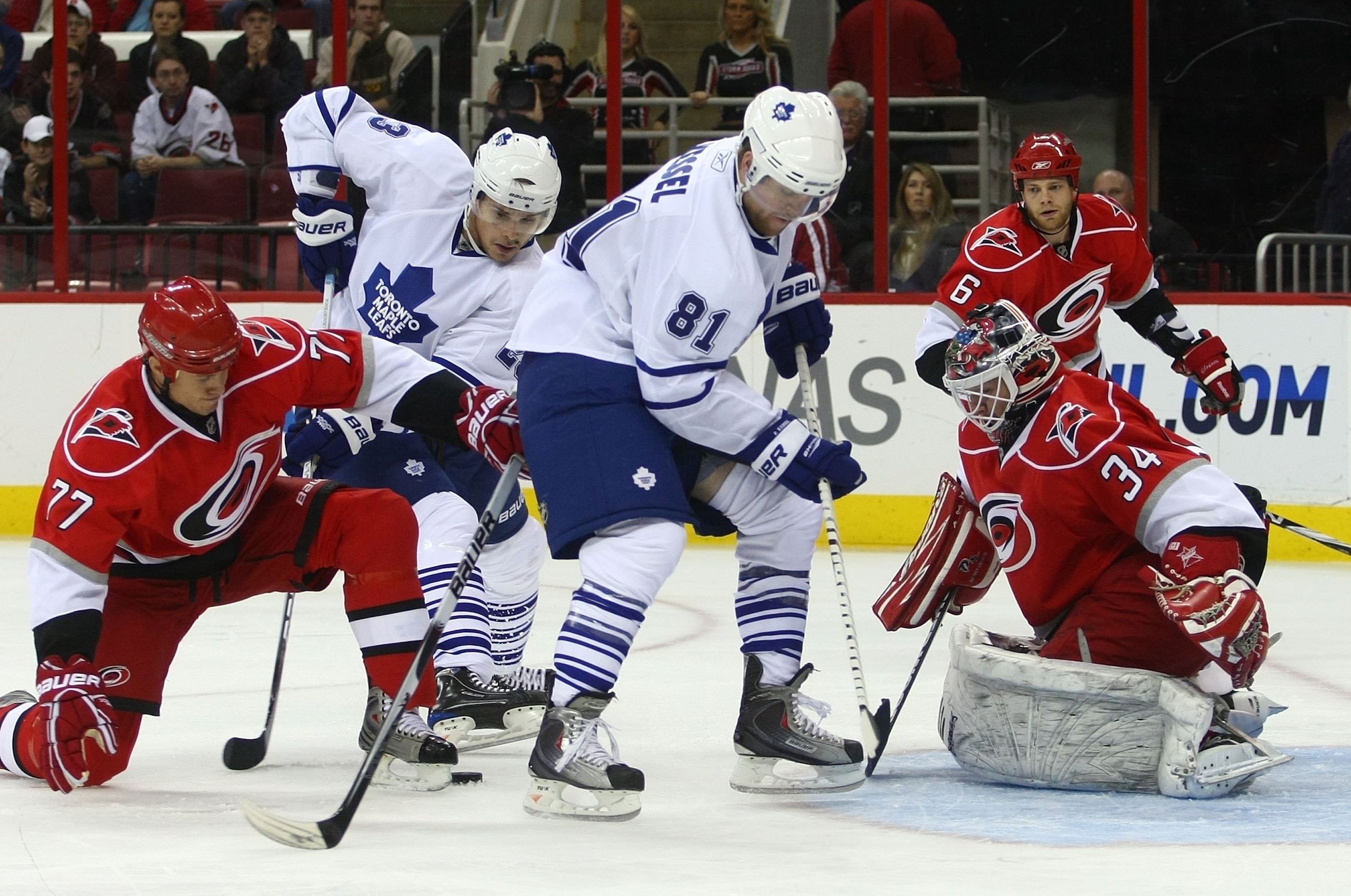 RALEIGH, NC - NOVEMBER 19:  Alexei Ponikarovsky #23 and Phil Kessel #81 of the Toronto Maple Leafs are stopped by Manny Legace #34 of the Carolina Hurricanes at the RBC Center on November 19, 2009 in Raleigh, North Carolina.  (Photo by Bruce Bennett/Getty