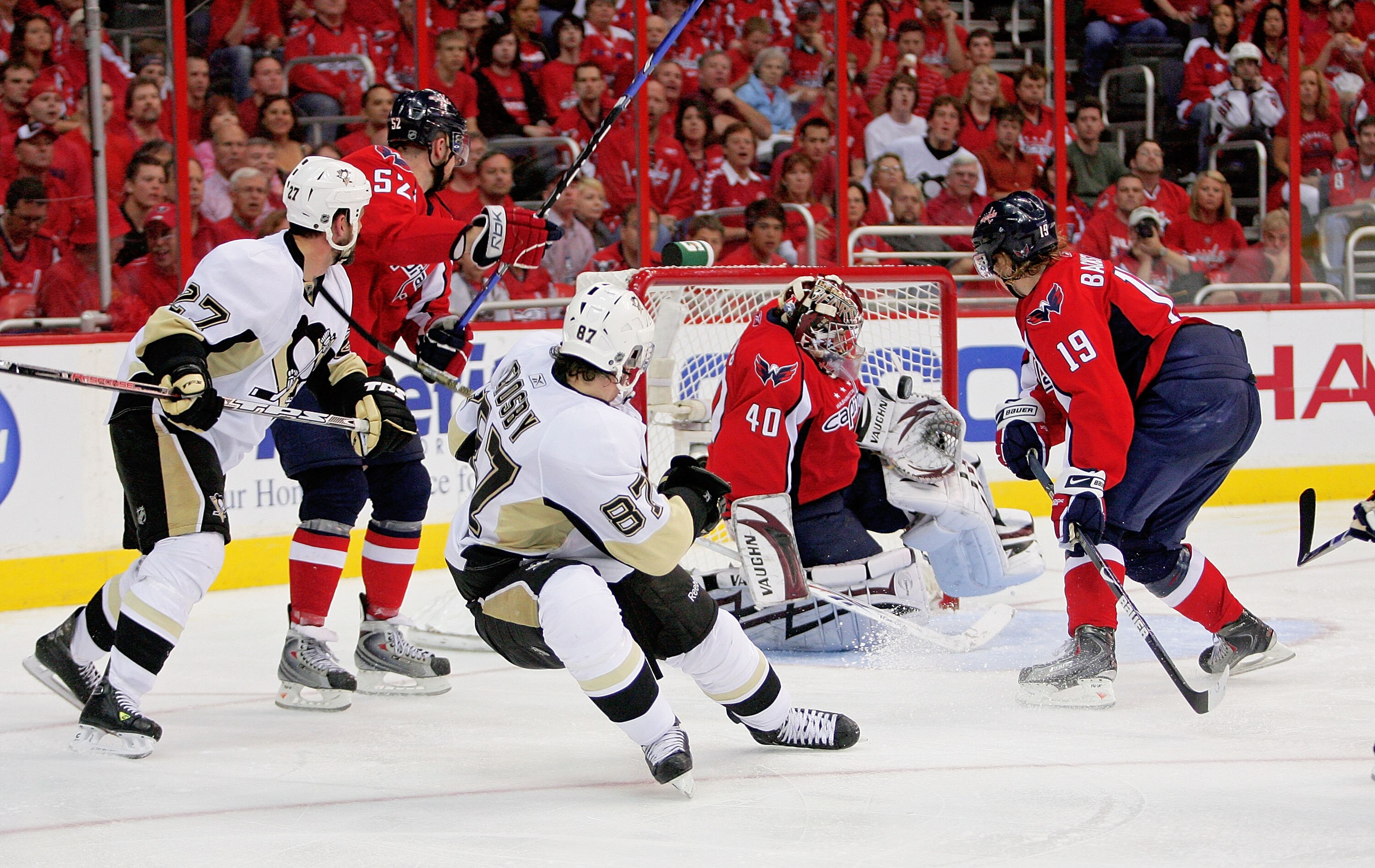 WASHINGTON - MAY 09:  Mike Green #52, Simeon Varlamov #40 and Nicklas Backstrom #19 of the Washington Capitals stop a scoring attempt by Sidney Crosby #87 and Craig Adams #27 of the Pittsburgh Penguins during Game Five of the Eastern Conference Semifinal