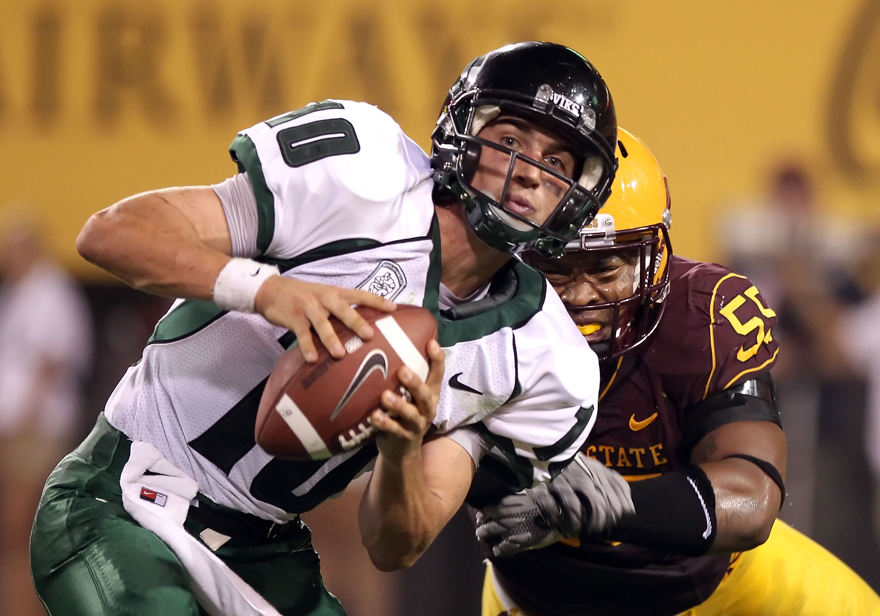 TEMPE, AZ - SEPTEMBER 04:  Quarterback Connor Kavanaugh #10 of the Portland State Vikings avoids a sack from Jamarr Robinson #55 of the Arizona State Sun Devils during the first quarter of the college football game at Sun Devil Stadium on September 4, 201