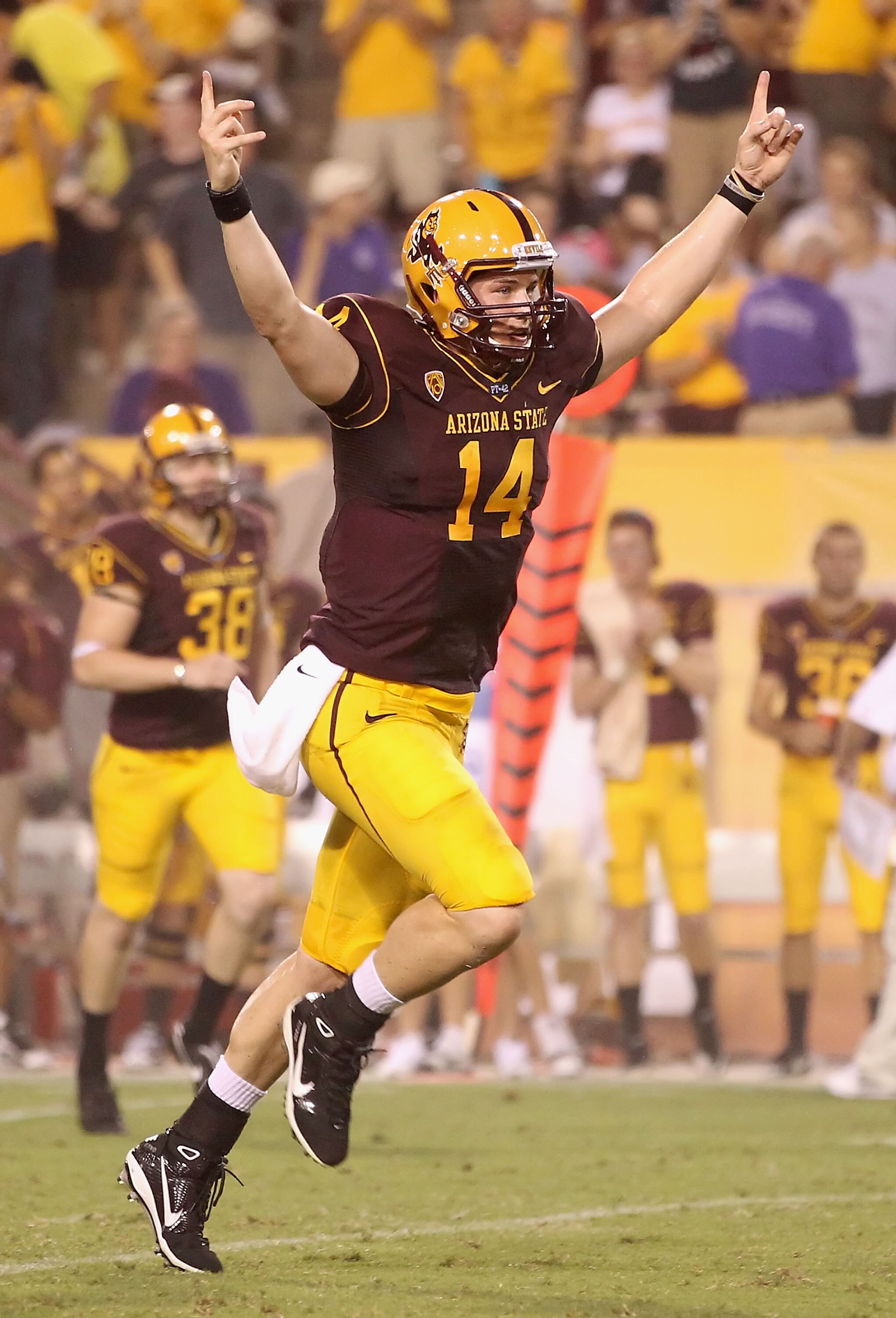 TEMPE, AZ - SEPTEMBER 04:  Quarterback Steven Threet #14 of the Arizona State Sun Devils celebrates after throwing a 37 yard reception during the second quarter of the college football game against the Portland State Vikings at Sun Devil Stadium on Septem