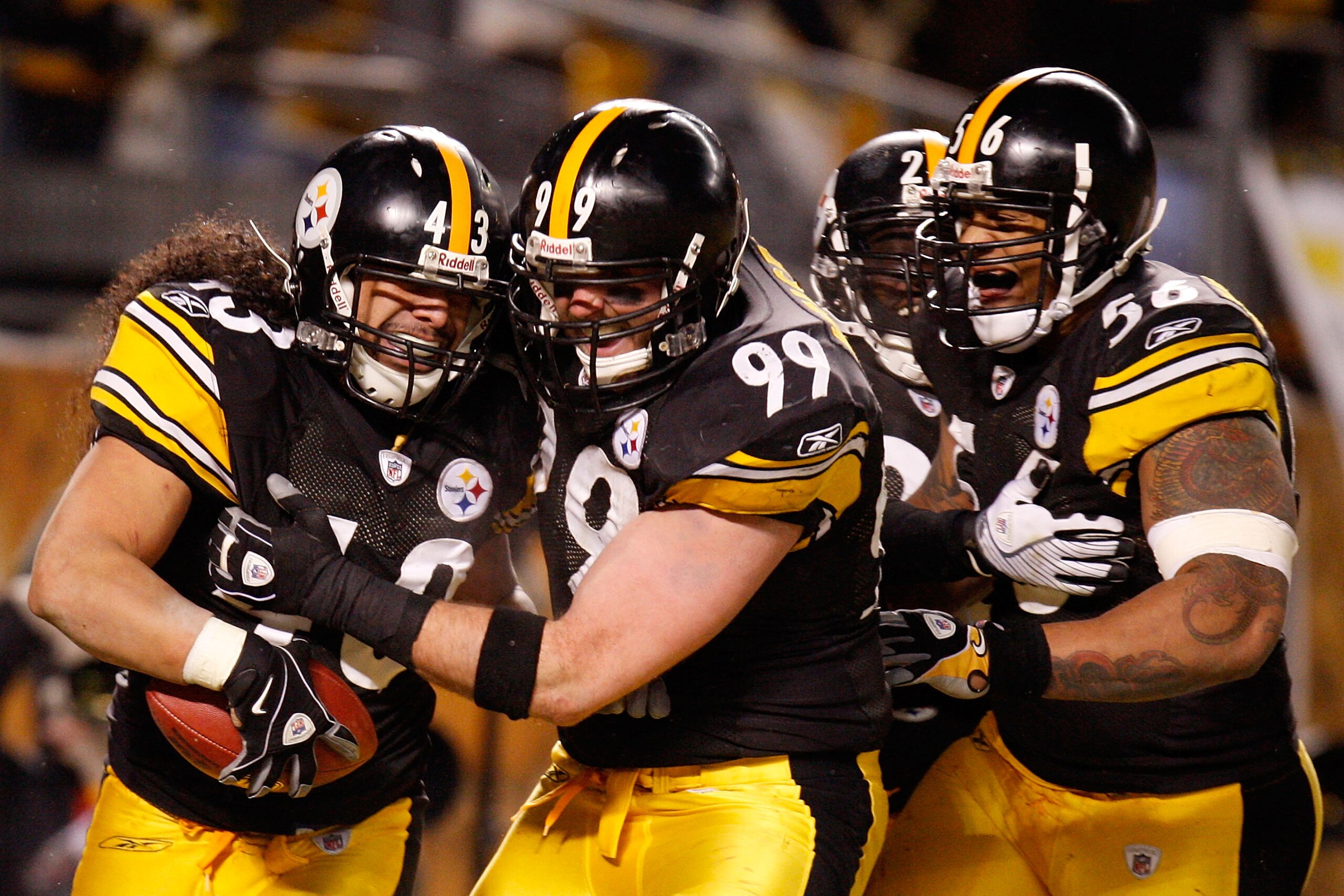 PITTSBURGH - JANUARY 18:  Safety Troy Polamalu #43 of the Pittsburgh Steelers celebrates his touchdown with defensive end Brett Keisel #99, safety Tyrone Carter #23 and linebacker LaMarr Woodley #56 against the Baltimore Ravens during the fourth quarter o