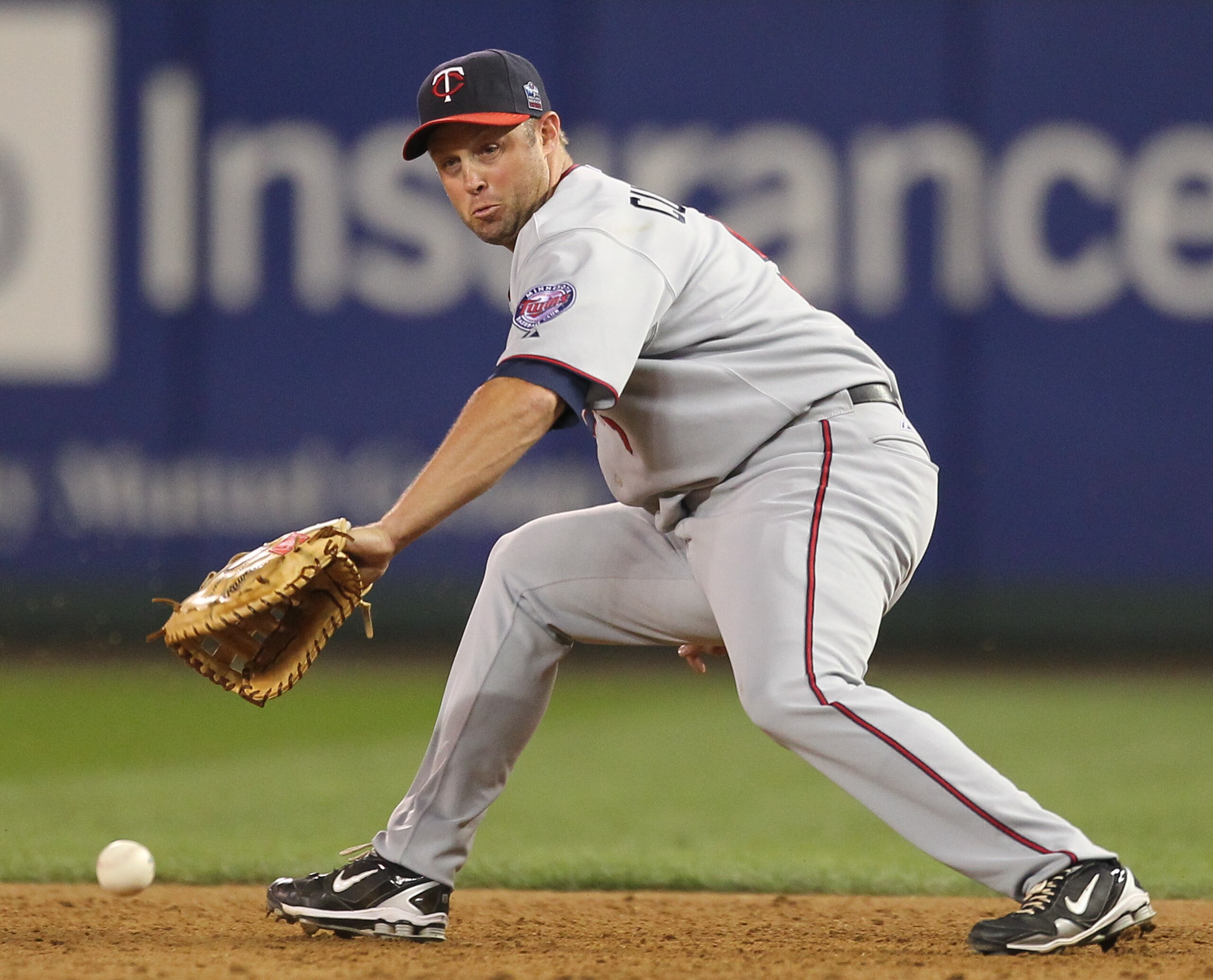 SEATTLE - AUGUST 27: First baseman Michael Cuddyer #5 of the Minnesota Twins misses fielding a grounder by Chone Figgins of the Seattle Mariners at Safeco Field on August 27, 2010 in Seattle, Washington. The Twins won 6-3. (Photo by Otto Greule Jr/Getty SEATTLE - AUGUST 27: First baseman Michael Cuddyer #5 of the Minnesota Twins misses fielding a grounder by Chone Figgins of the Seattle Mariners at Safeco Field on August 27, 2010 in Seattle, Washington. The Twins won 6-3. (Photo by Otto Greule Jr/Getty