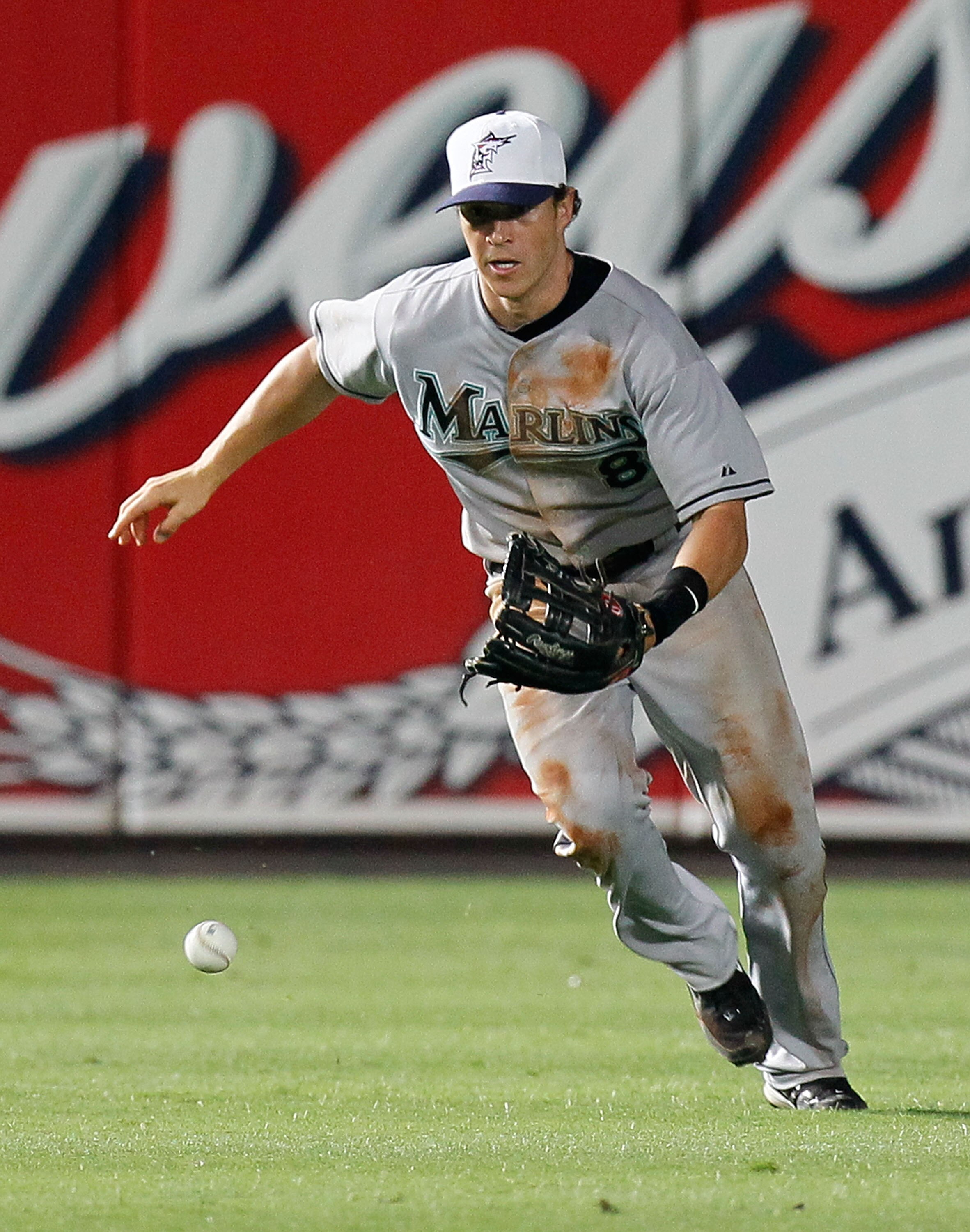 ATLANTA - JULY 02:  Chris Coghlan #8 of the Florida Marlins runs to scoop up the two-run single hit by Omar Infante #4 (not pictured) of the Atlanta Braves in the 11th inning at Turner Field on July 2, 2010 in Atlanta, Georgia.  (Photo by Kevin C. Cox/Get