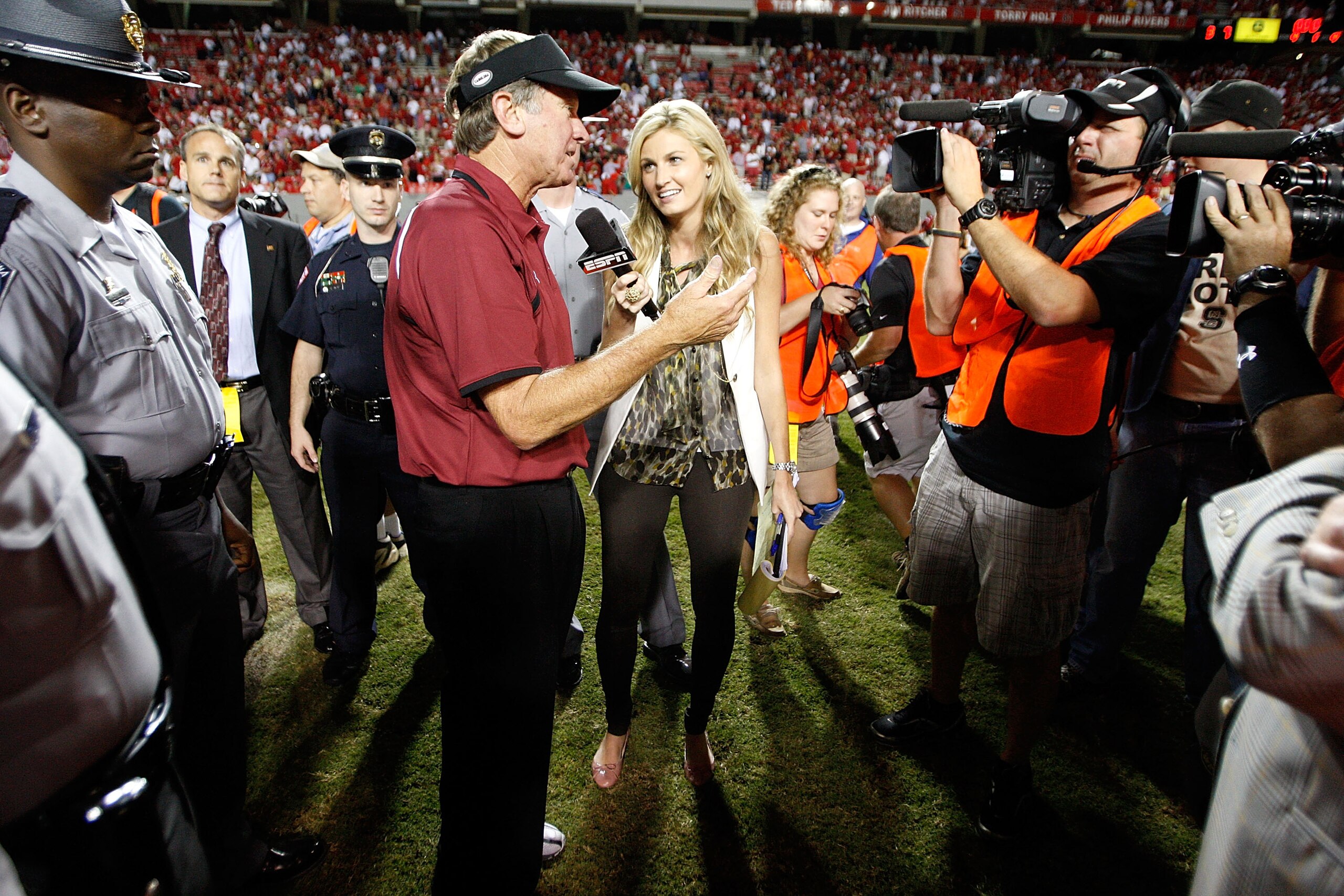 RALEIGH, NC - SEPTEMBER 3:  ESPN sideline reporter Erin Andrews interviews head coach Steve Spurrier of the South Carolina Gamecocks after their game against the North Carolina State Wolfpack at Carter-Finley Stadium on September 3, 2009 in Raleigh, North