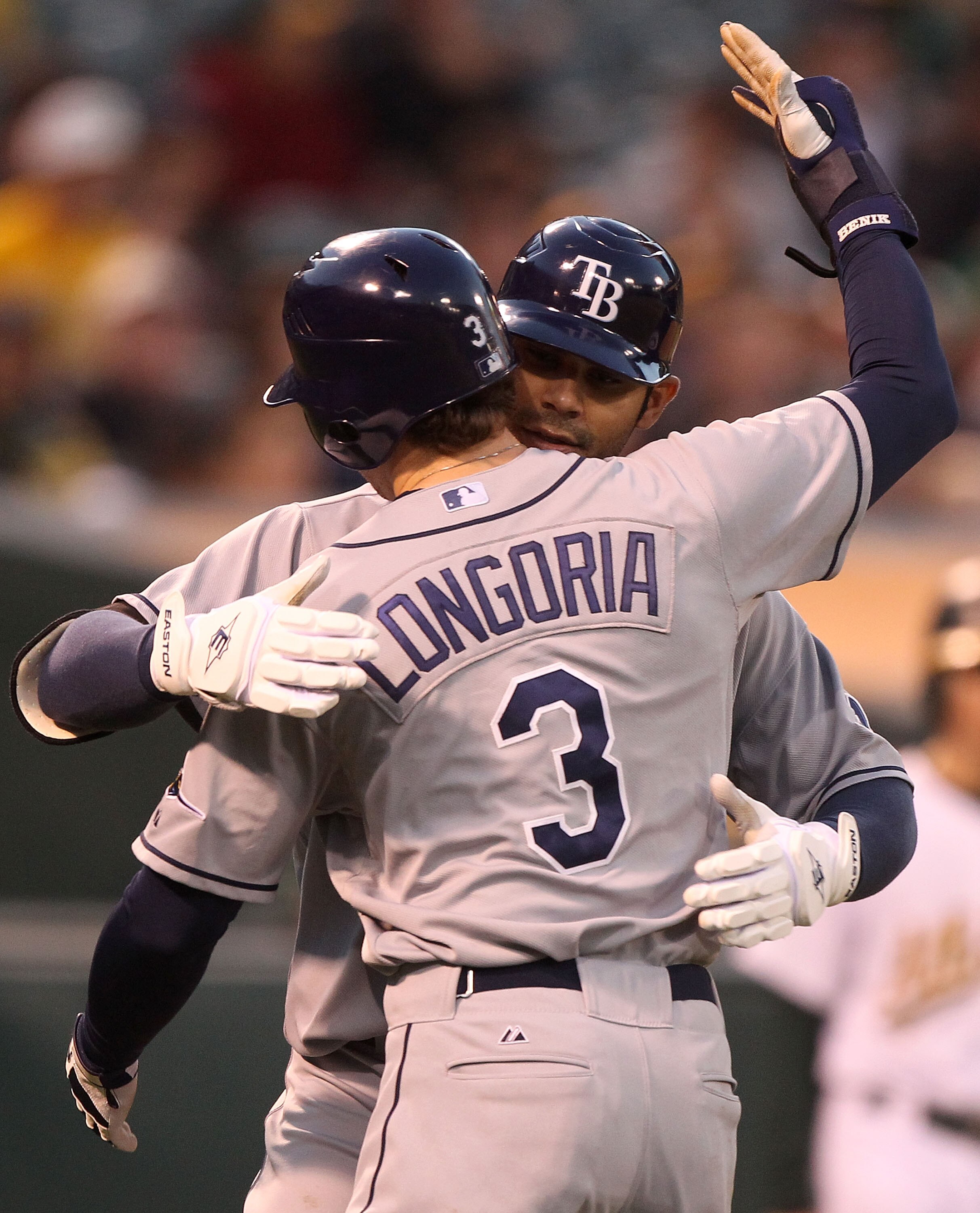 OAKLAND, CA - AUGUST 19:  Carlos Pena #23 of the Tampa Bay Rays celebrates with Evan Longoria #3 after hitting a two run home run against the Oakland Athletics in the fourth inning during an MLB game at the Oakland-Alameda County Coliseum on August 19, 20