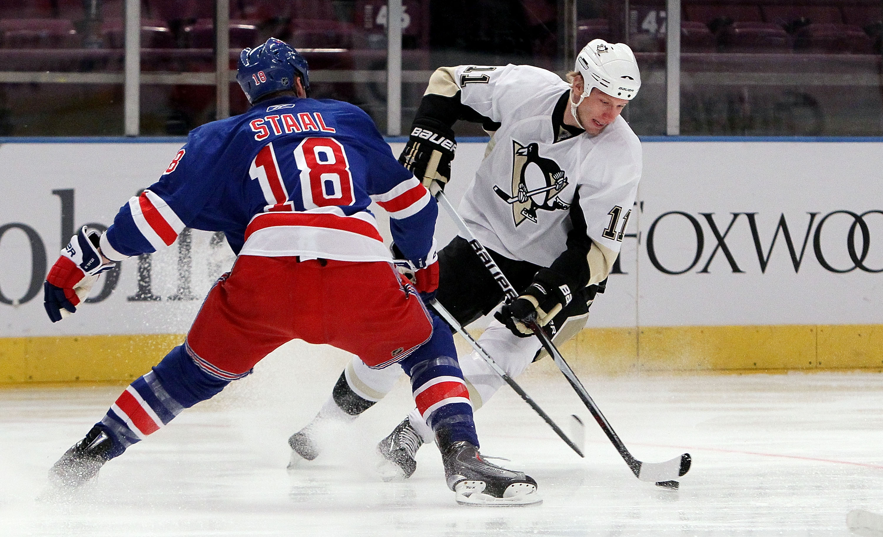 NEW YORK - MARCH 04:  Jordan Staal #11 of the Pittsburgh Penguins skates against Marc Staal #18 of the New York Rangers on March 4, 2010 at Madison Square Garden in New York City.  (Photo by Jim McIsaac/Getty Images)