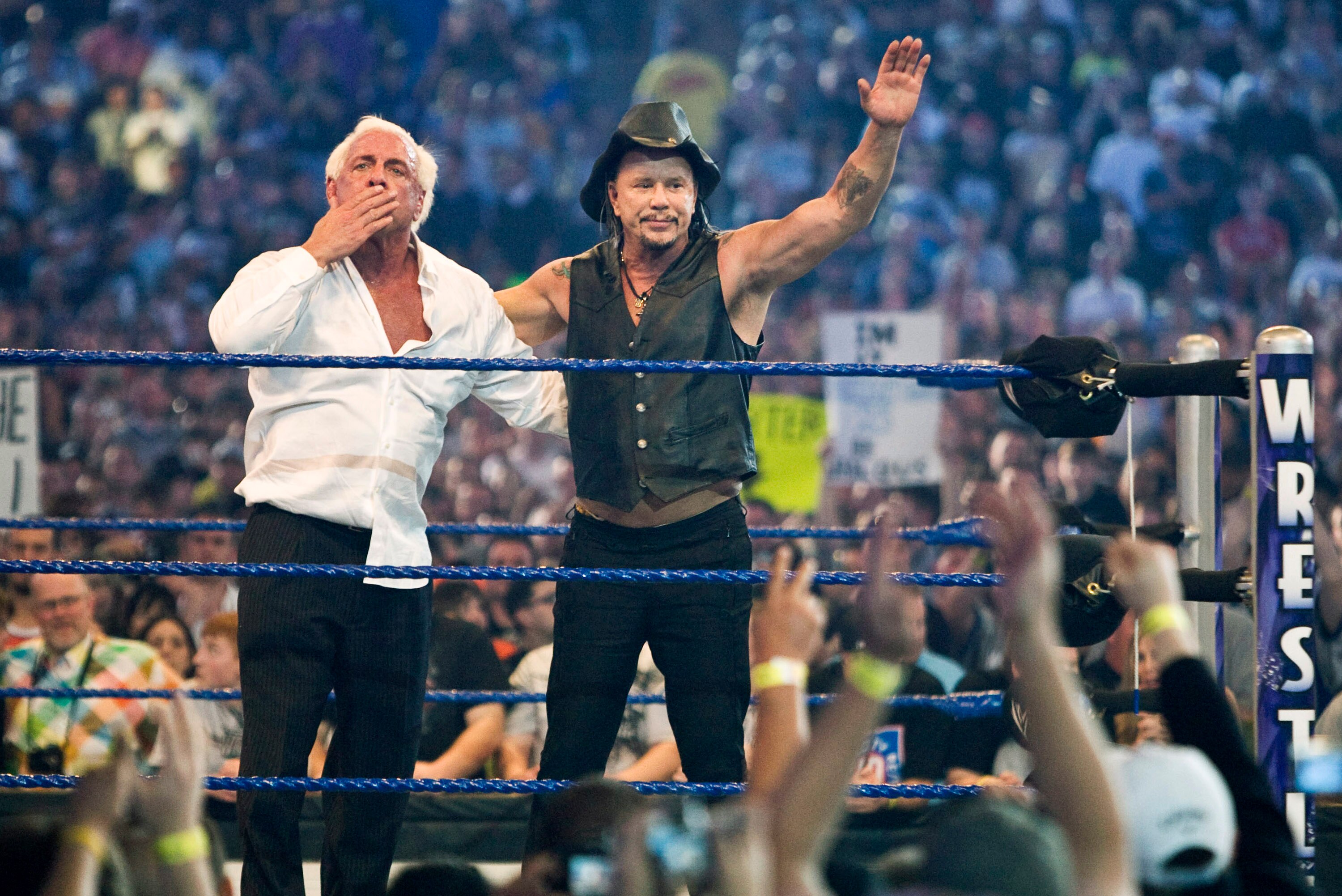HOUSTON, TX - APRIL 5: (L-R) Actor Mickey Rourke celebrates with Ric Flair after beating WWE Superstar Chris Jericho during WrestleMania 25 at Reliant Stadium on April 5, 2009 in Houston, Texas.  (Photo by Bill Olive/Getty Images)