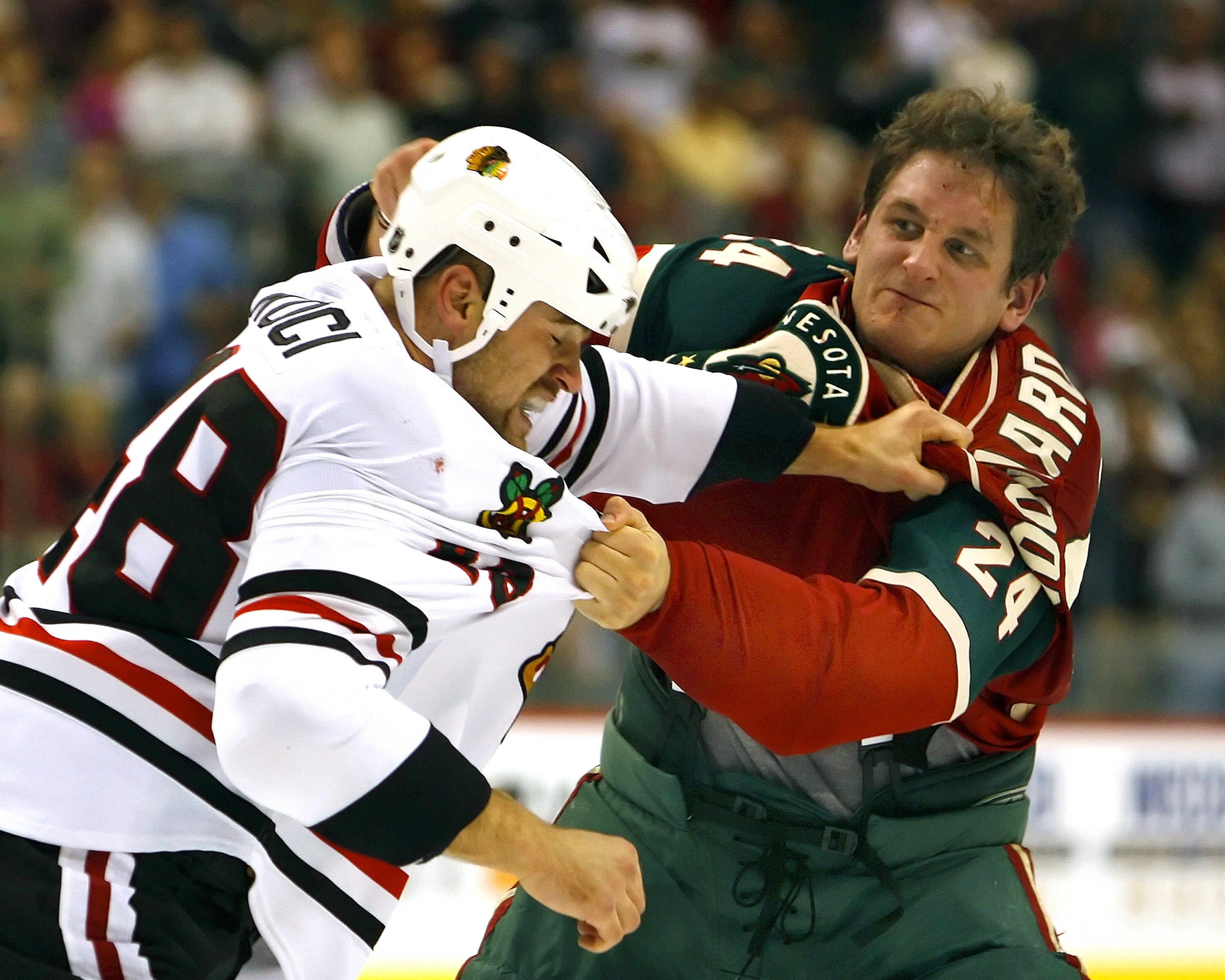 ST. PAUL, MN - OCTOBER 4:  David Koci #48 of the Chicago Blackhawks and Derek Boogaard #24 of the Minnesota Wild fight in the second period of their game October 4, 2007 at the Xcel Energy Center in St. Paul, Minnesota. (Photo by Scott A. Schneider/Getty 