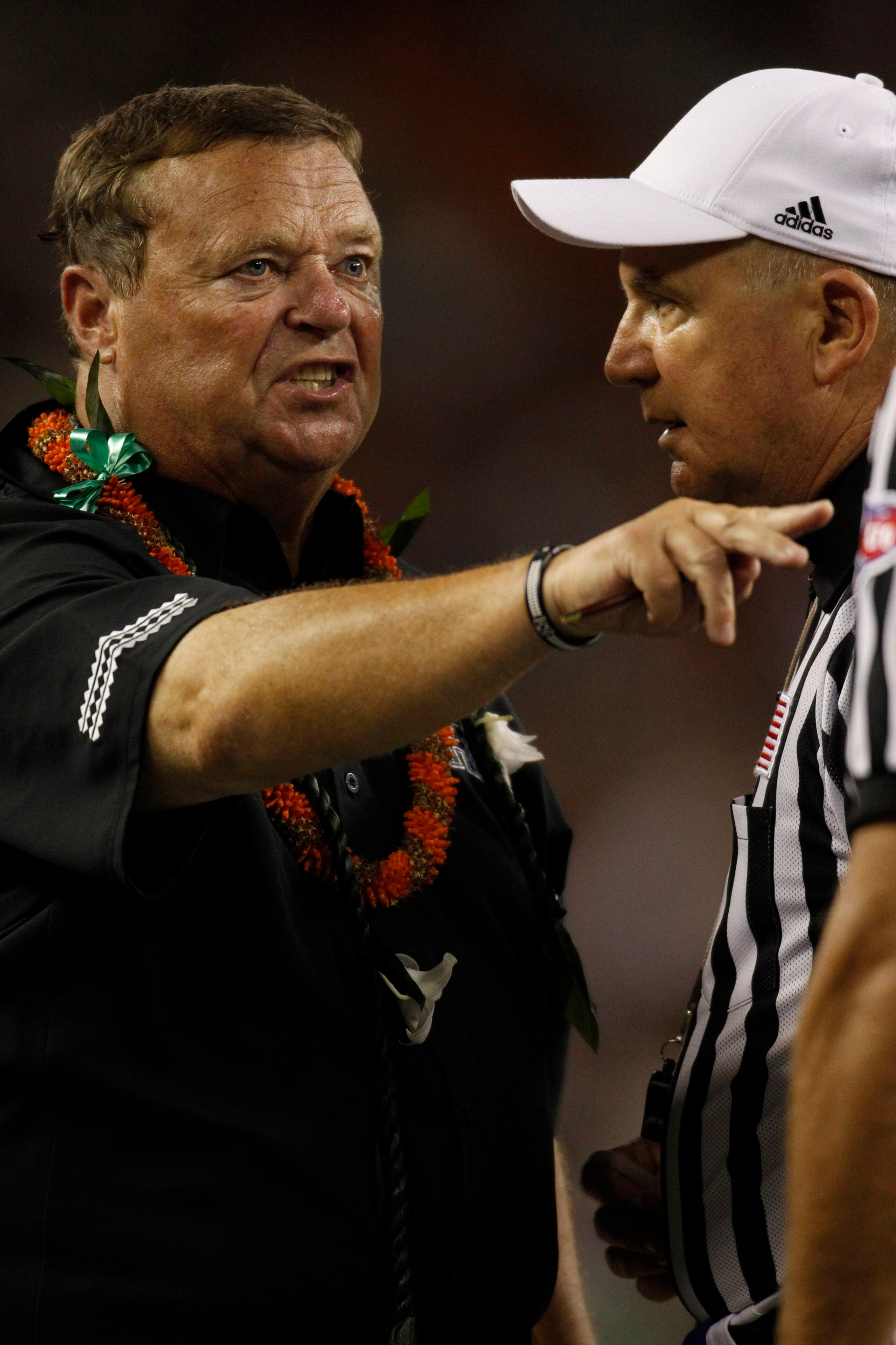 HONOLULU - SEPTEMBER 2:  Head Coach Greg McMackin of the University of Hawaii Warriors exchanges words with game officials during second half action at Aloha Stadium September 2, 2010 in Honolulu, Hawaii. (Photo by Kent Nishimura/Getty Images)