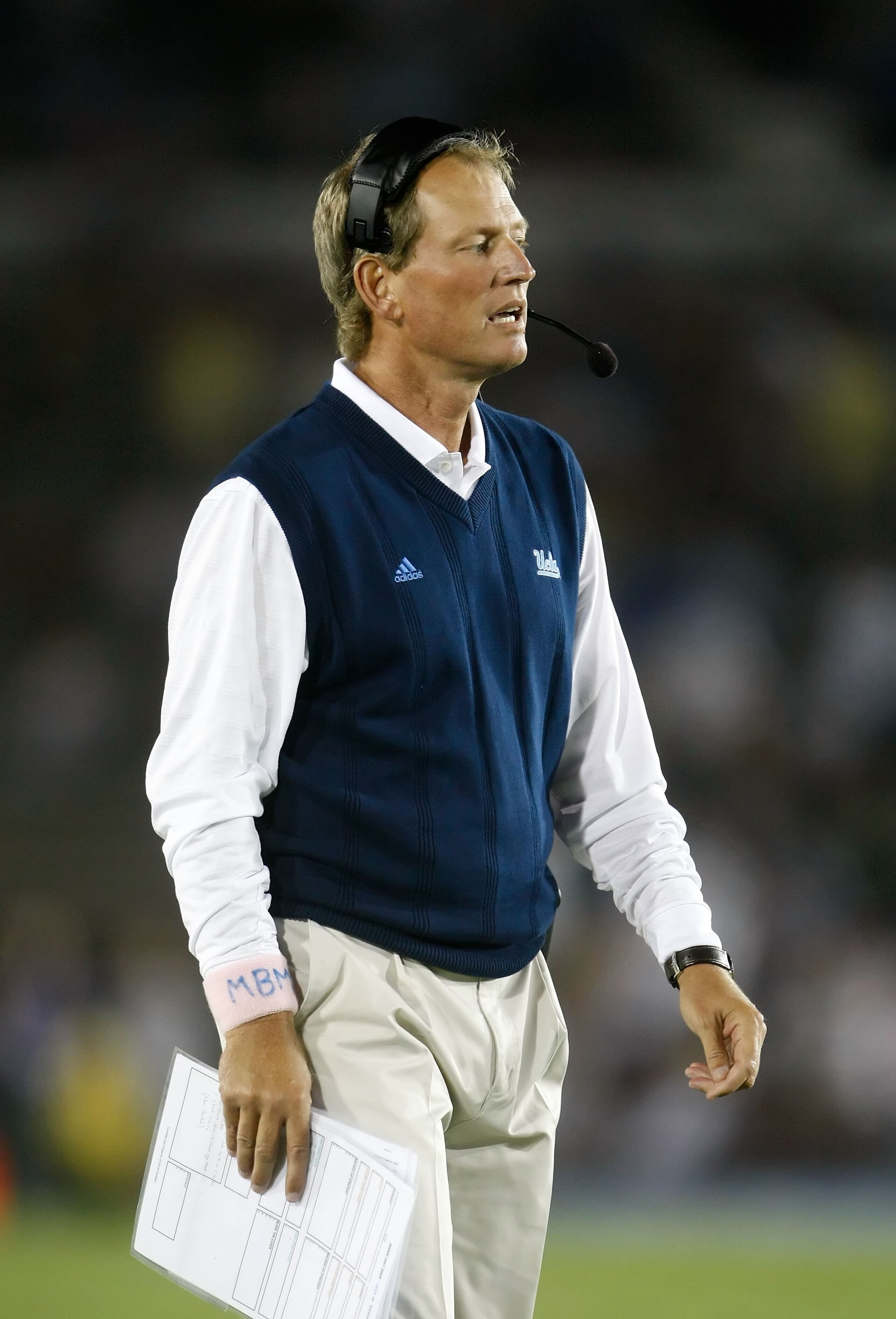 PASADENA, CA - SEPTEMBER 19:  UCLA Bruins head coach Rick Neuheisel looks on from the sideline against the Kansas State Wildcats at the Rose Bowl on September 19, 2009 in Pasadena, California. UCLA defeated Kansas State 23-9.  (Photo by Jeff Gross/Getty I