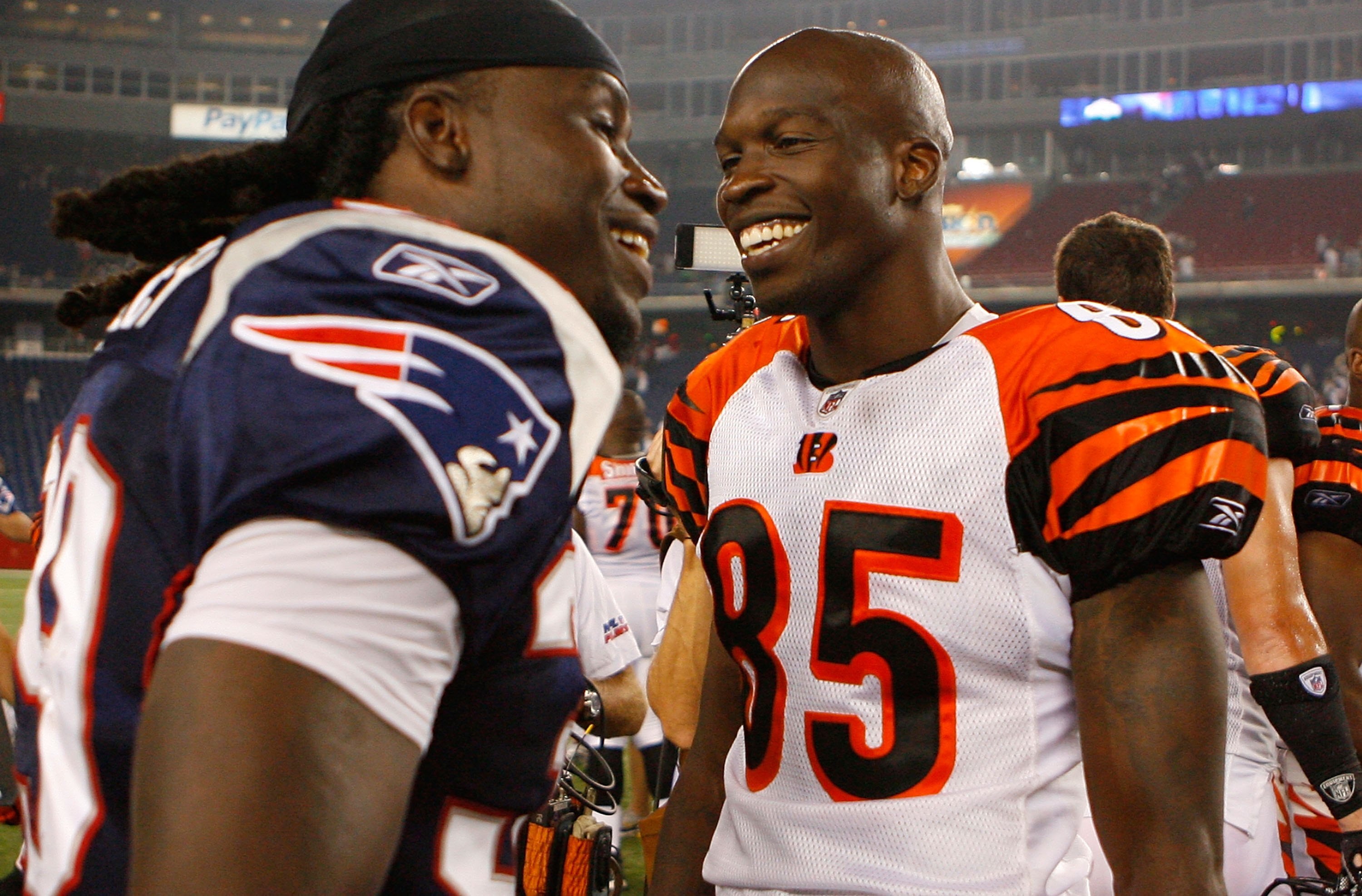 FOXBORO, MA - AUGUST 20:  Lawrence Maroney #39 of the New England Patriots chats with Chad Ochocinco #85 of the Cincinnati Bengals after a preseason game at Gillette Stadium on August 20, 2009 in Foxboro, Massachusetts. (Photo by Jim Rogash/Getty Images)