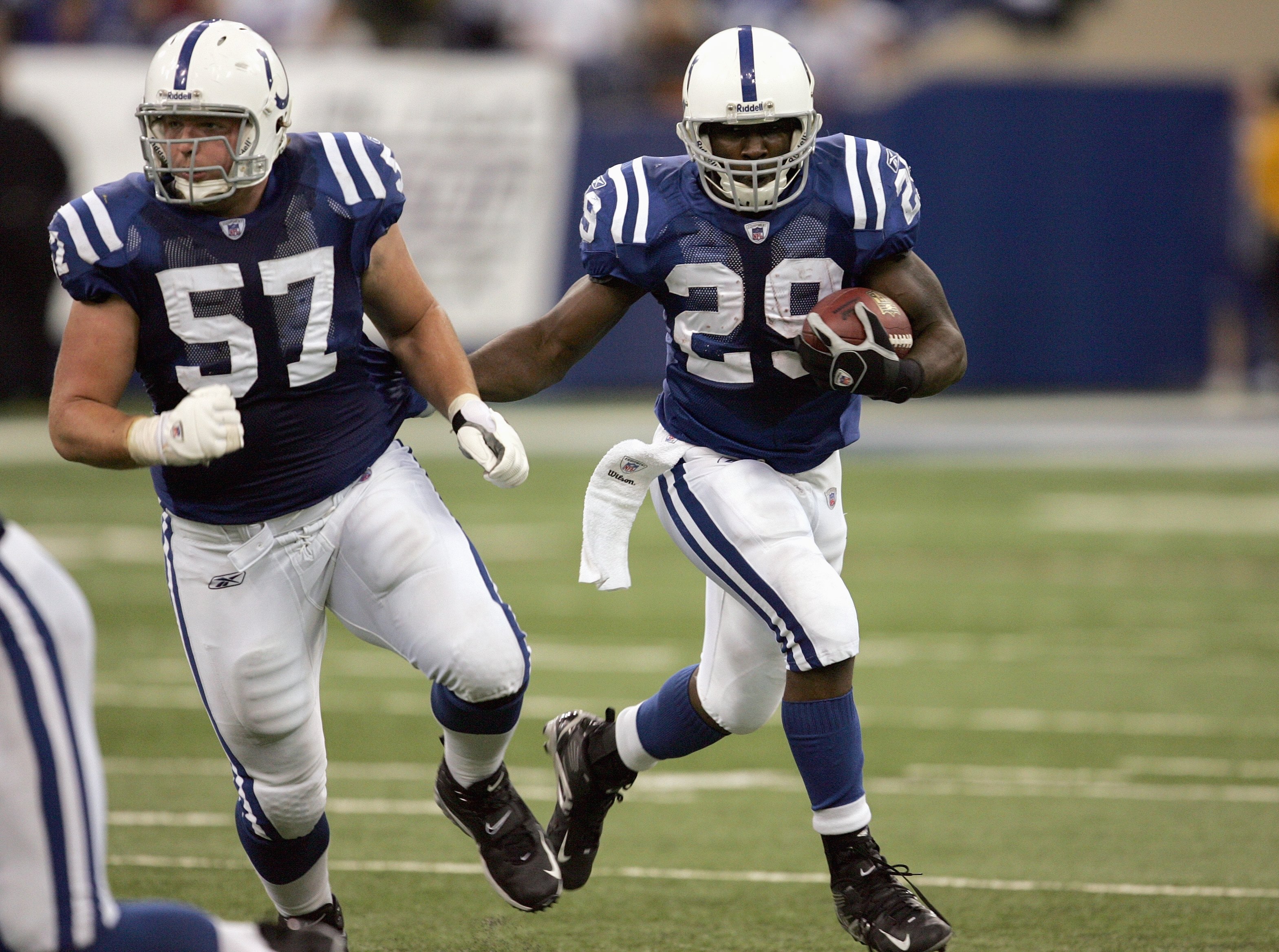 INDIANAPOLIS - NOVEMBER 12:  Joseph Addai #29 of the Indianapolis Colts carries the ball with Dylan Gandy #57 during the game against the Buffalo Bills on November 12, 2006 at the RCA Dome in Indianapolis, Indiana. The Colts defeated the Bills 17-16. (Pho