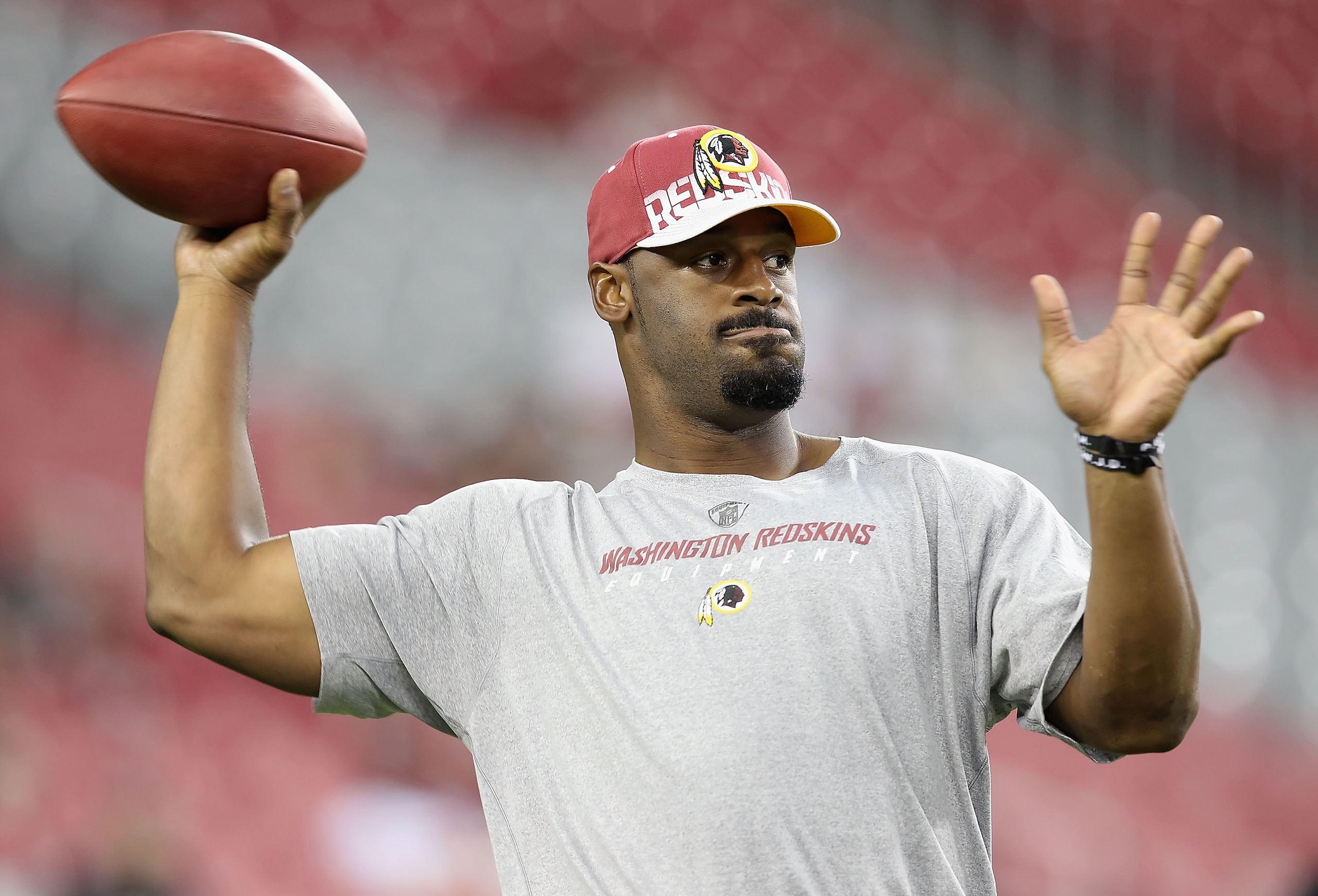 GLENDALE, AZ - SEPTEMBER 02:  Quarterback Donovan McNabb #5 of the Washington Redskins warms up before the preseason NFL game against the Arizona Cardinals at the University of Phoenix Stadium on September 2, 2010 in Glendale, Arizona.  (Photo by Christia