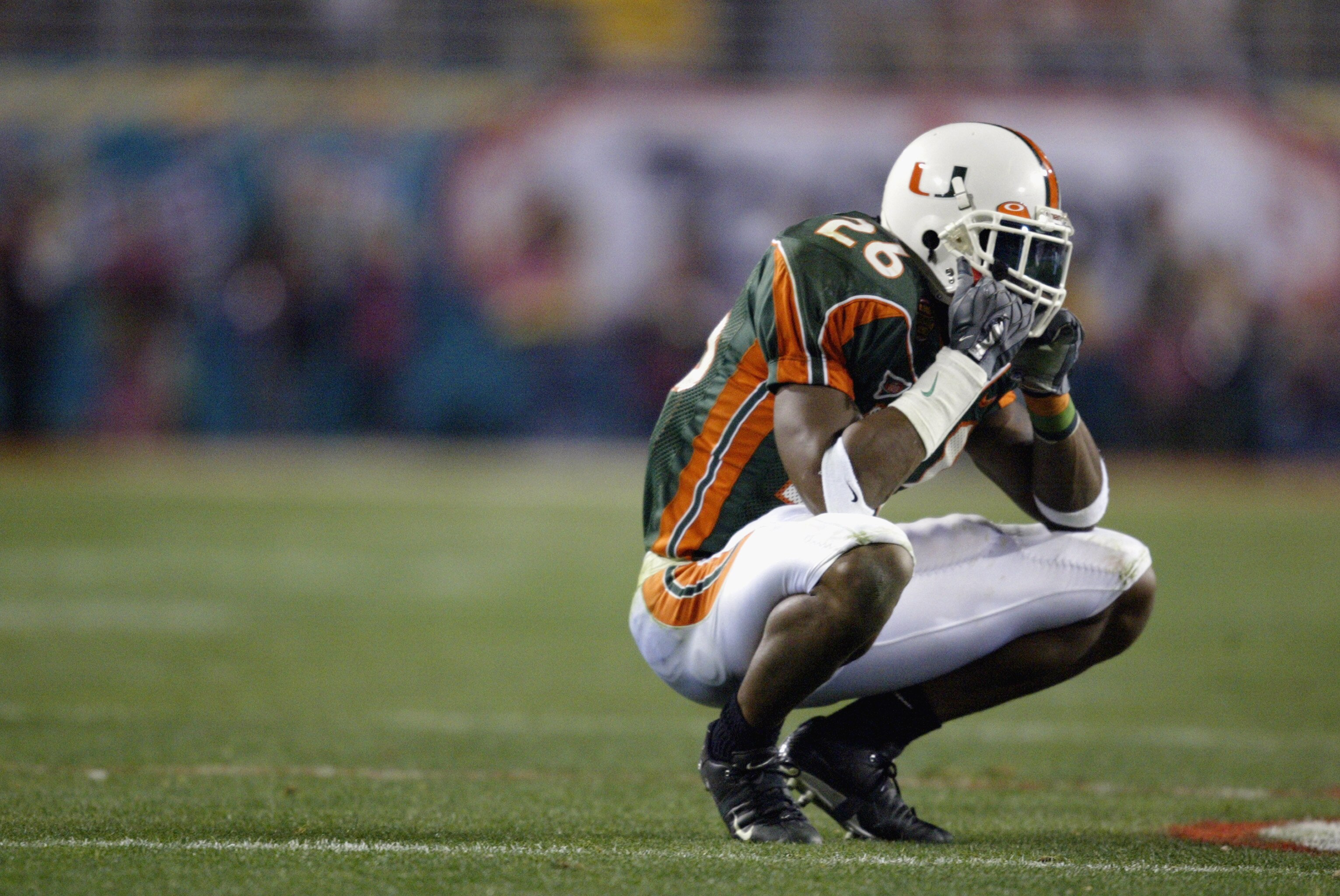 TEMPE, AZ - JANUARY 3:  Defensive back Sean Taylor #26 of the Miami Hurricanes sits dejected after being stripped of an interception by running back Maurice Clarett #13 of the Ohio State Buckeyes during the Tostitos Fiesta Bowl on January 3, 2003 at Sun D