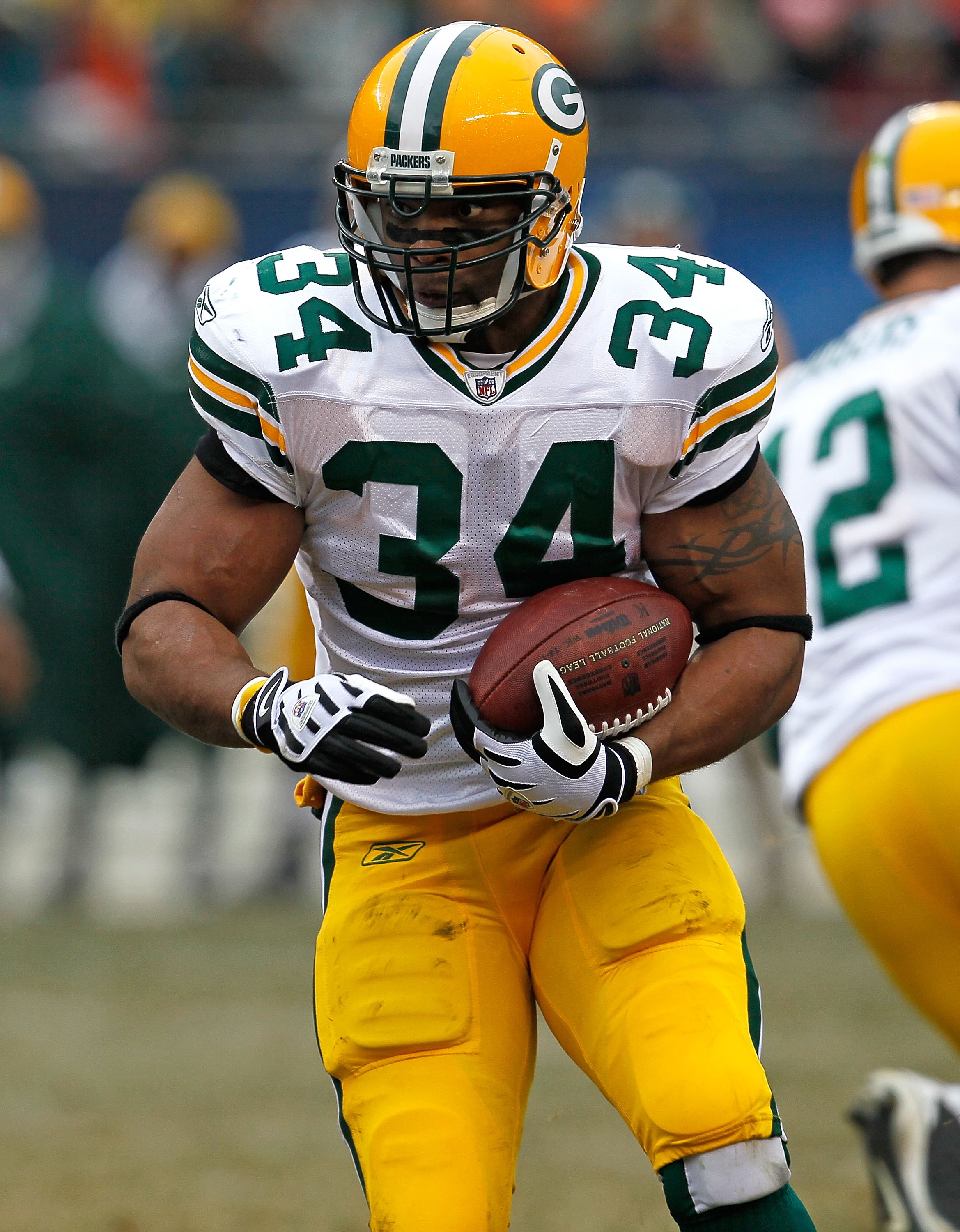 CHICAGO - DECEMBER 13: Ahman Green #34 of the Green Bay Packers runs against the Chicago Bears at Soldier Field on December 13, 2009 in Chicago, Illinois. The Packers defeated the Bears 21-14. (Photo by Jonathan Daniel/Getty Images)