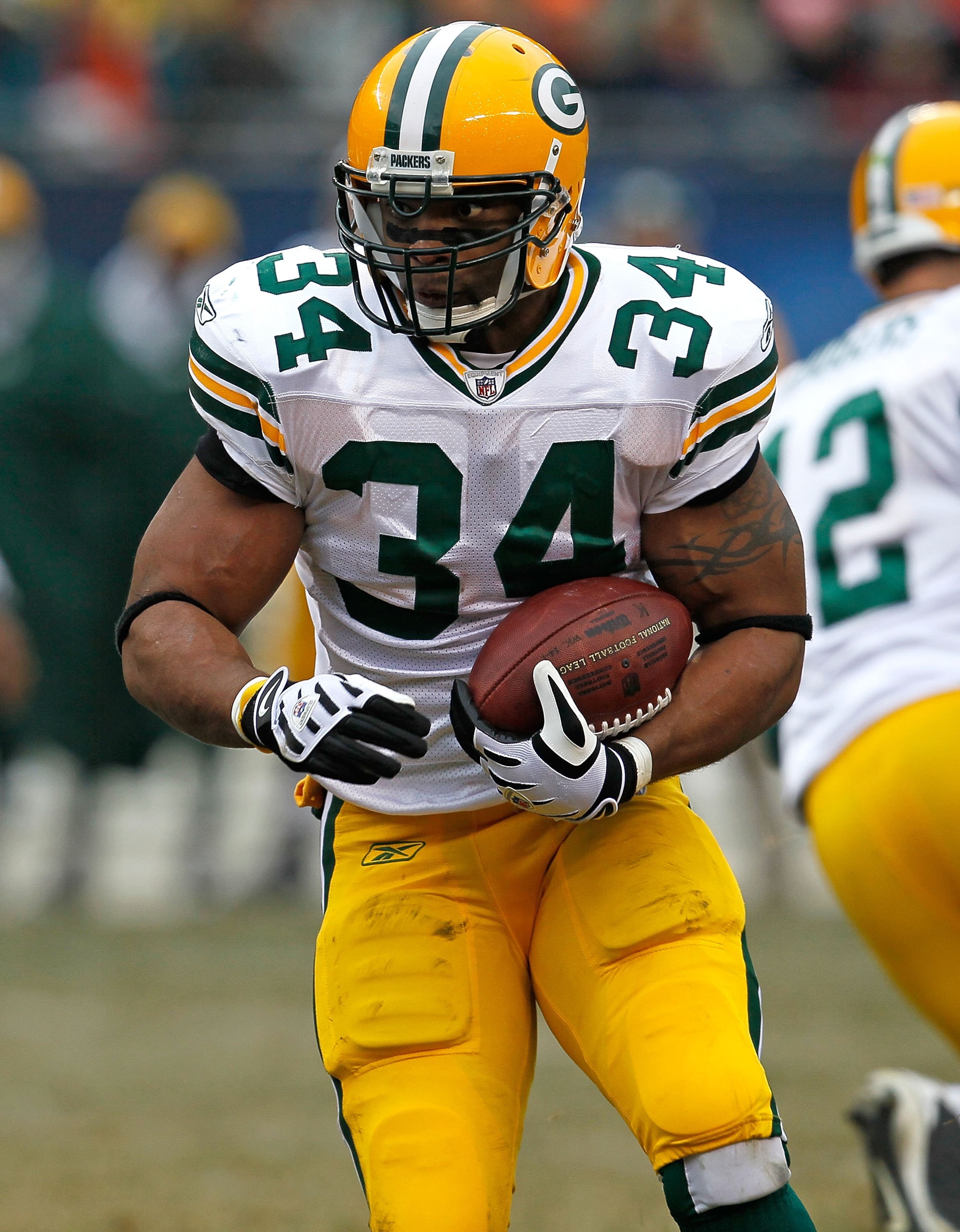 CHICAGO - DECEMBER 13: Ahman Green #34 of the Green Bay Packers runs against the Chicago Bears at Soldier Field on December 13, 2009 in Chicago, Illinois. The Packers defeated the Bears 21-14. (Photo by Jonathan Daniel/Getty Images)