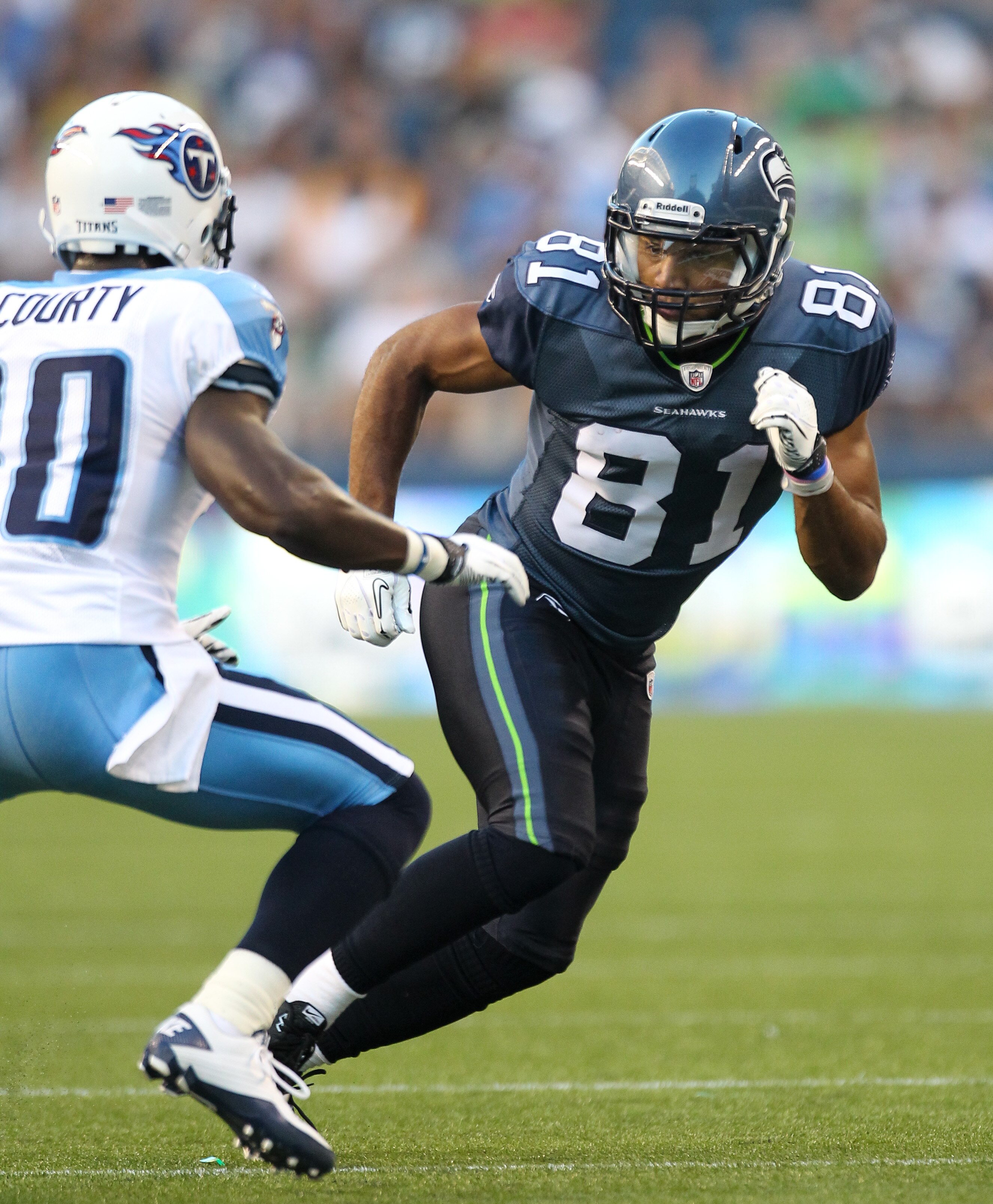 SEATTLE - AUGUST 14:  Wide receiver Golden Tate #81 of the Seattle Seahawks rushes during the preseason game against Jason McCourty #30 of the Tennessee Titans at Qwest Field on August 14, 2010 in Seattle, Washington. (Photo by Otto Greule Jr/Getty Images