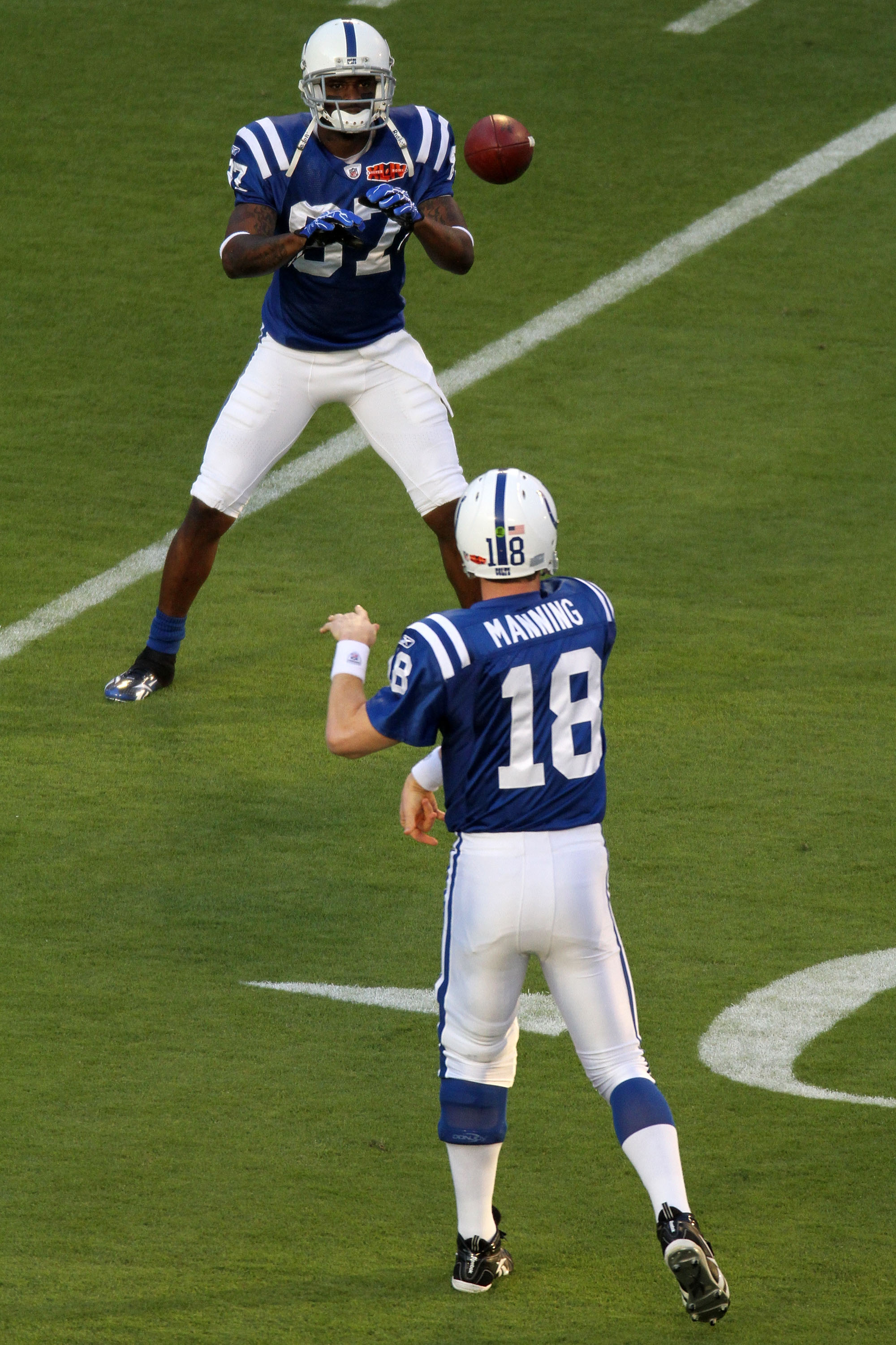 MIAMI GARDENS, FL - FEBRUARY 07:  Quarterback Peyton Manning #18 and wide receiver  Reggie Wayne #87 of the Indianapolis Colts warm up prior to Super Bowl XLIV against the New Orleans Saints on February 7, 2010 at Sun Life Stadium in Miami Gardens, Florid