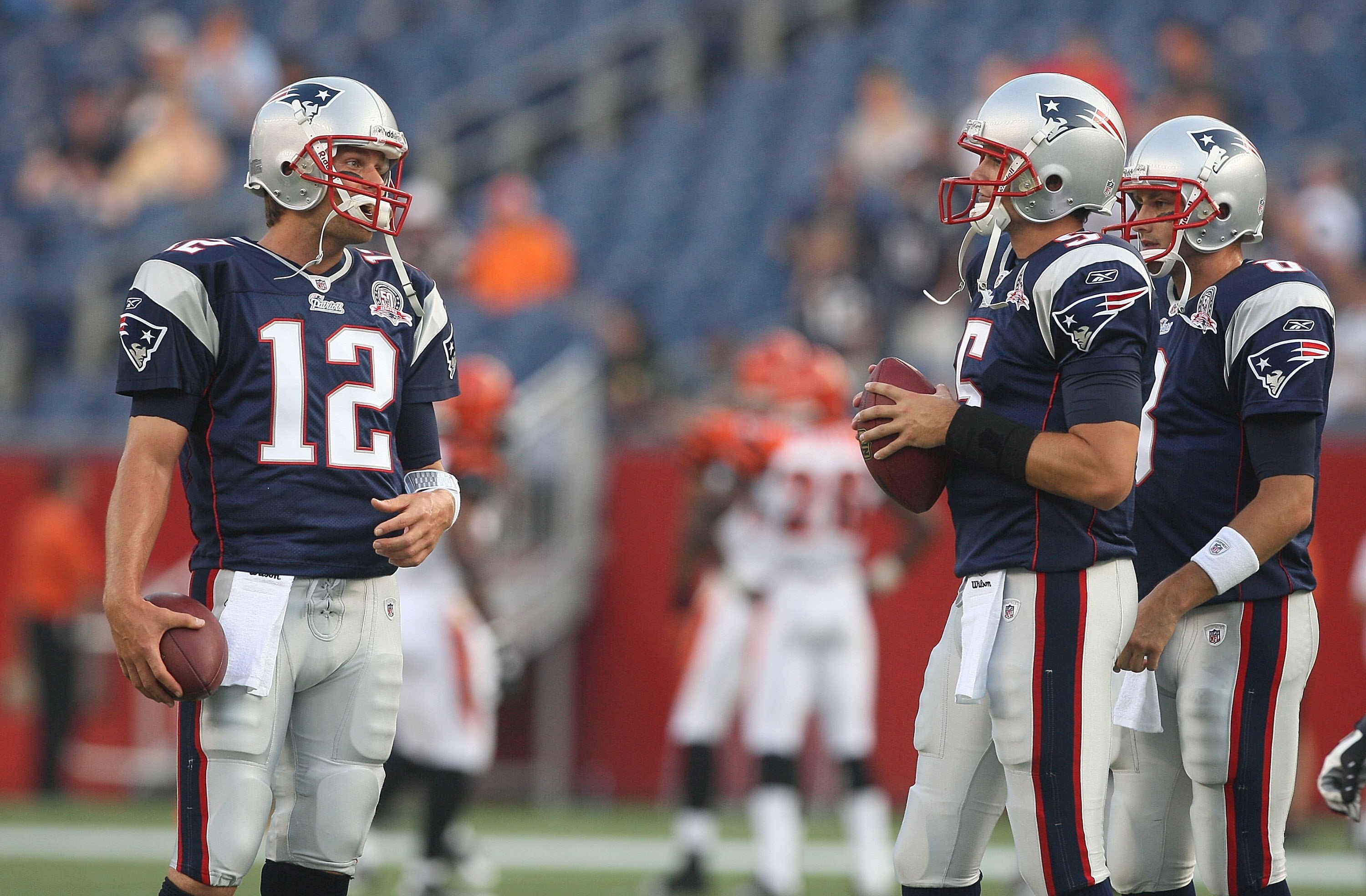 FOXBORO, MA - AUGUST 20:  Tom Brady #12 chats with Kevin O'Connell #5 and Brian Hoyer #8, all of the New England Patriots, before a game against the Cincinnati Bengals at Gillette Stadium on August 20, 2009 in Foxboro, Massachusetts. (Photo by Jim Rogash/