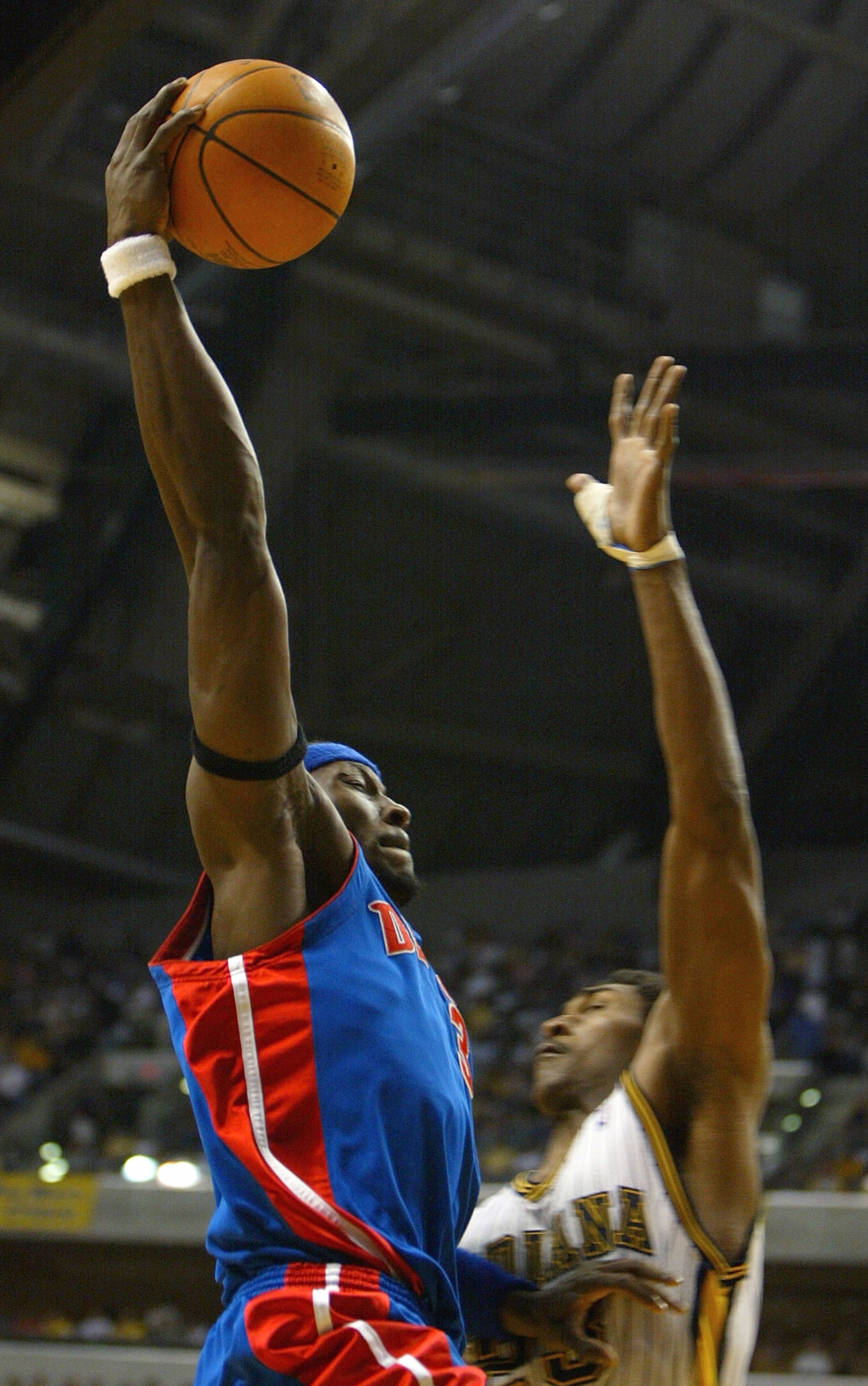 INDIANAPOLIS - MAY 24: Ben Wallace #3 of the Detroit Pistons goes up for a basket over Ron Artest #23 of the Indiana Pacers in Game two of the Eastern Conference Finals during the 2004 NBA Playoffs at Conseco Fieldhouse on May 24, 2004 in Indianapolis, I INDIANAPOLIS - MAY 24: Ben Wallace #3 of the Detroit Pistons goes up for a basket over Ron Artest #23 of the Indiana Pacers in Game two of the Eastern Conference Finals during the 2004 NBA Playoffs at Conseco Fieldhouse on May 24, 2004 in Indianapolis, I