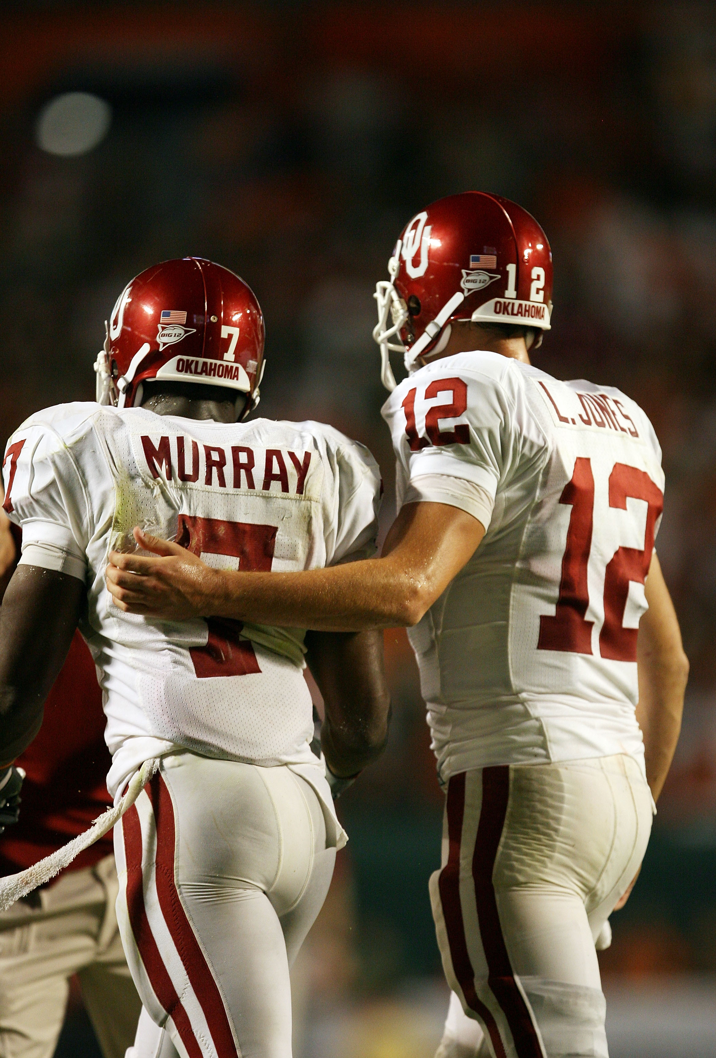 FORT LAUDERDALE, FL - OCTOBER 03: Quarterback Landry Jones #12 of the Oklahoma Sooners congratulates congratulates running back DeMarco Murray #7 after Murray's touchdown run in the third quarter against the Miami Hurricanes at Land Shark Stadium on Octob FORT LAUDERDALE, FL - OCTOBER 03: Quarterback Landry Jones #12 of the Oklahoma Sooners congratulates congratulates running back DeMarco Murray #7 after Murray's touchdown run in the third quarter against the Miami Hurricanes at Land Shark Stadium on Octob