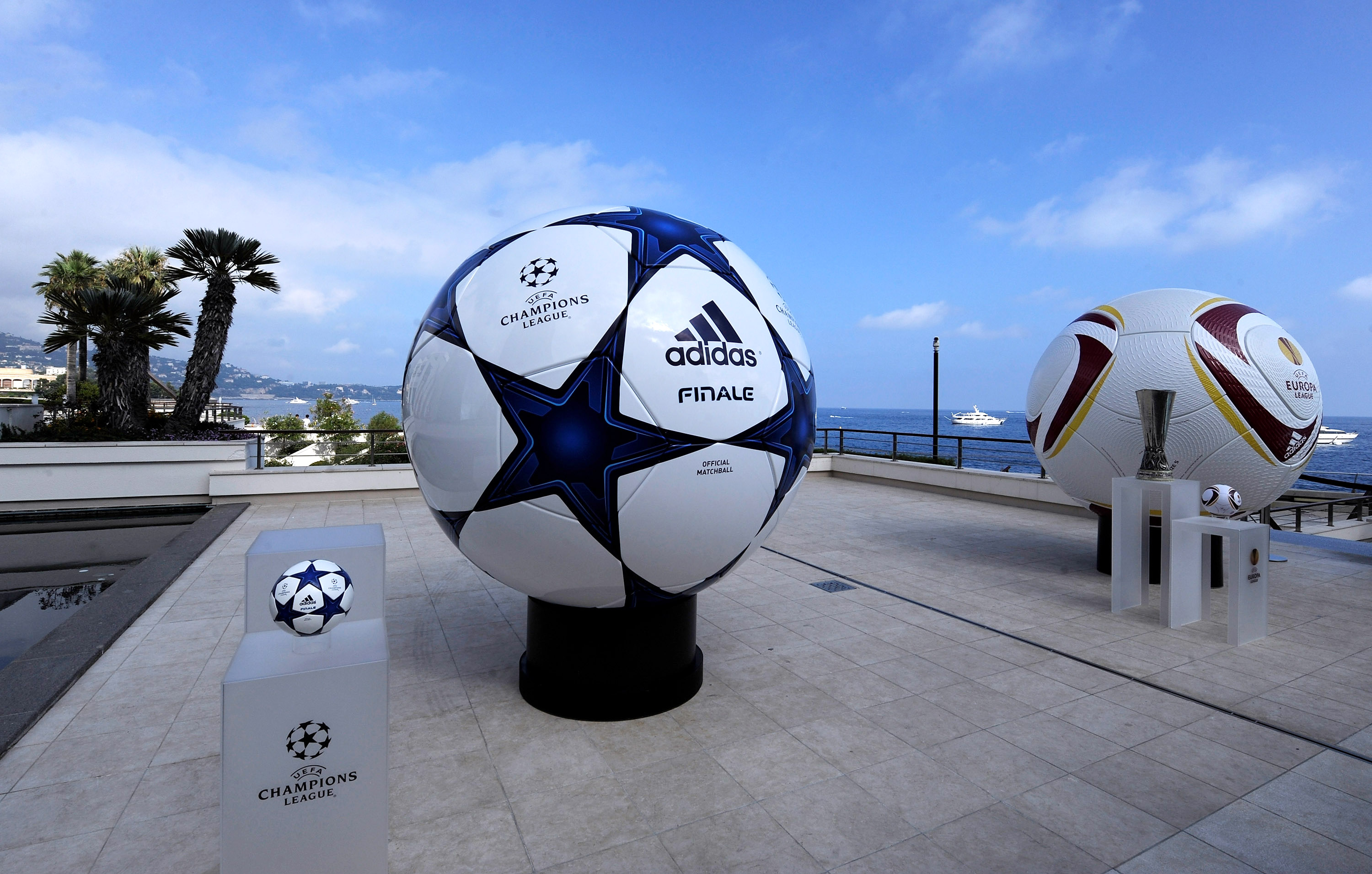 MONACO - AUGUST 26:  Adidas balls on show alongside the three main European club trophies,the Champions League,Europa League and Super Cup during the UEFA Champions League Group Stage draw at the Grimaldi Forum on August 26, 2010 in Monaco, Monaco.  (Phot
