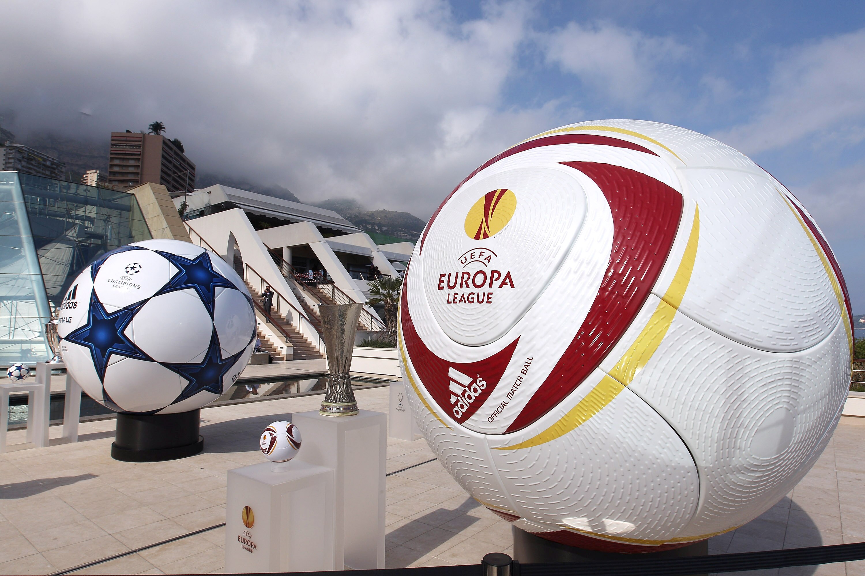 MONACO - AUGUST 26:  Adidas balls on show alongside the three main European club trophies, the Champions League, Europa League and Super Cup during the UEFA Champions League Group Stage draw at the Grimaldi Forum on August 26, 2010 in Monaco, Monaco.  (Ph