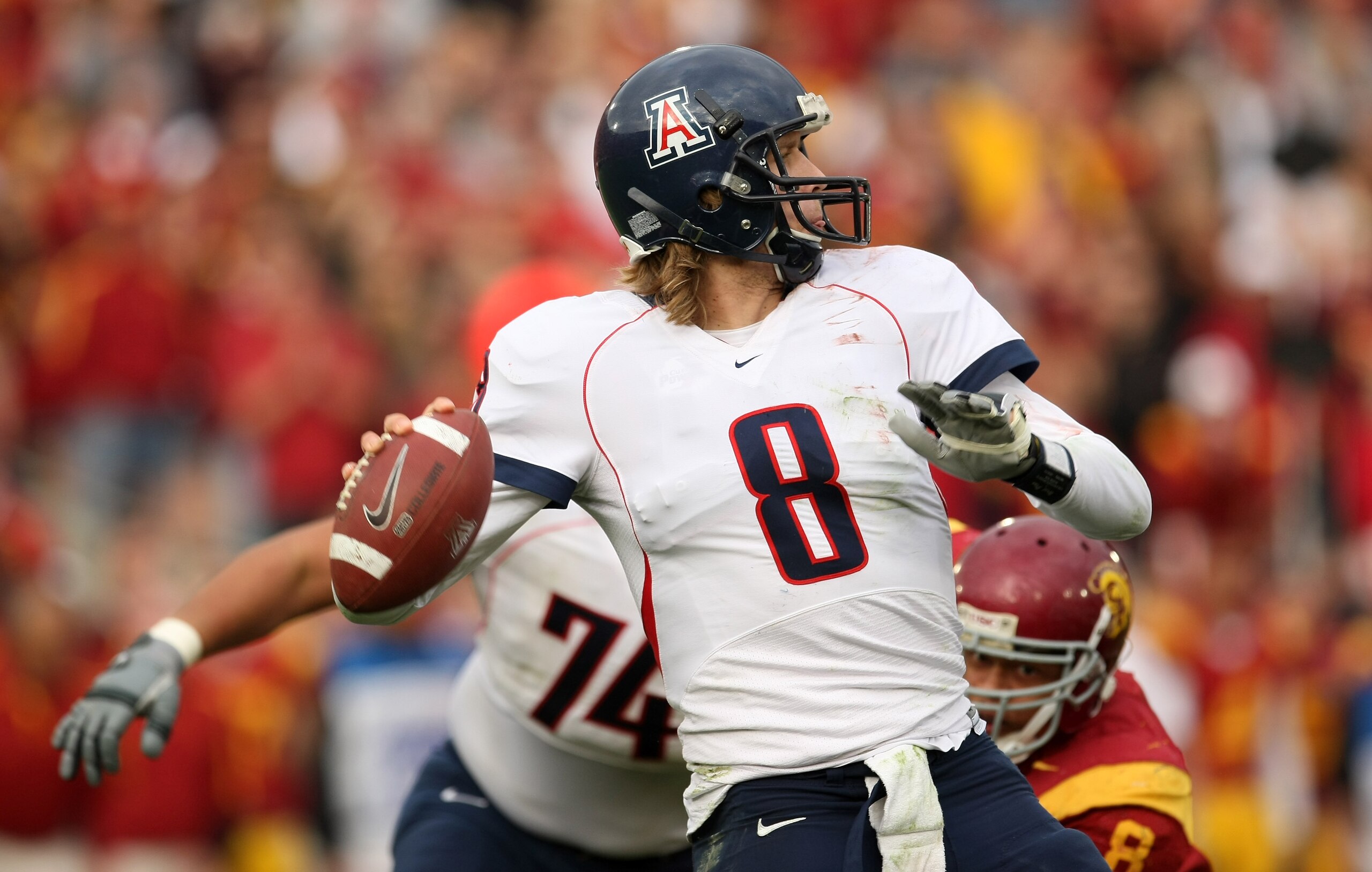 LOS ANGELES, CA - DECEMBER 05: Quarterback Nick Foles #8 of the Arizona Wildcats throws a pass against the USC Trojans on December 5, 2009 at the Los Angeles Coliseum in Los Angeles, California. Arizona won 21-17. (Photo by Stephen Dunn/Getty Images) LOS ANGELES, CA - DECEMBER 05: Quarterback Nick Foles #8 of the Arizona Wildcats throws a pass against the USC Trojans on December 5, 2009 at the Los Angeles Coliseum in Los Angeles, California. Arizona won 21-17. (Photo by Stephen Dunn/Getty Images)