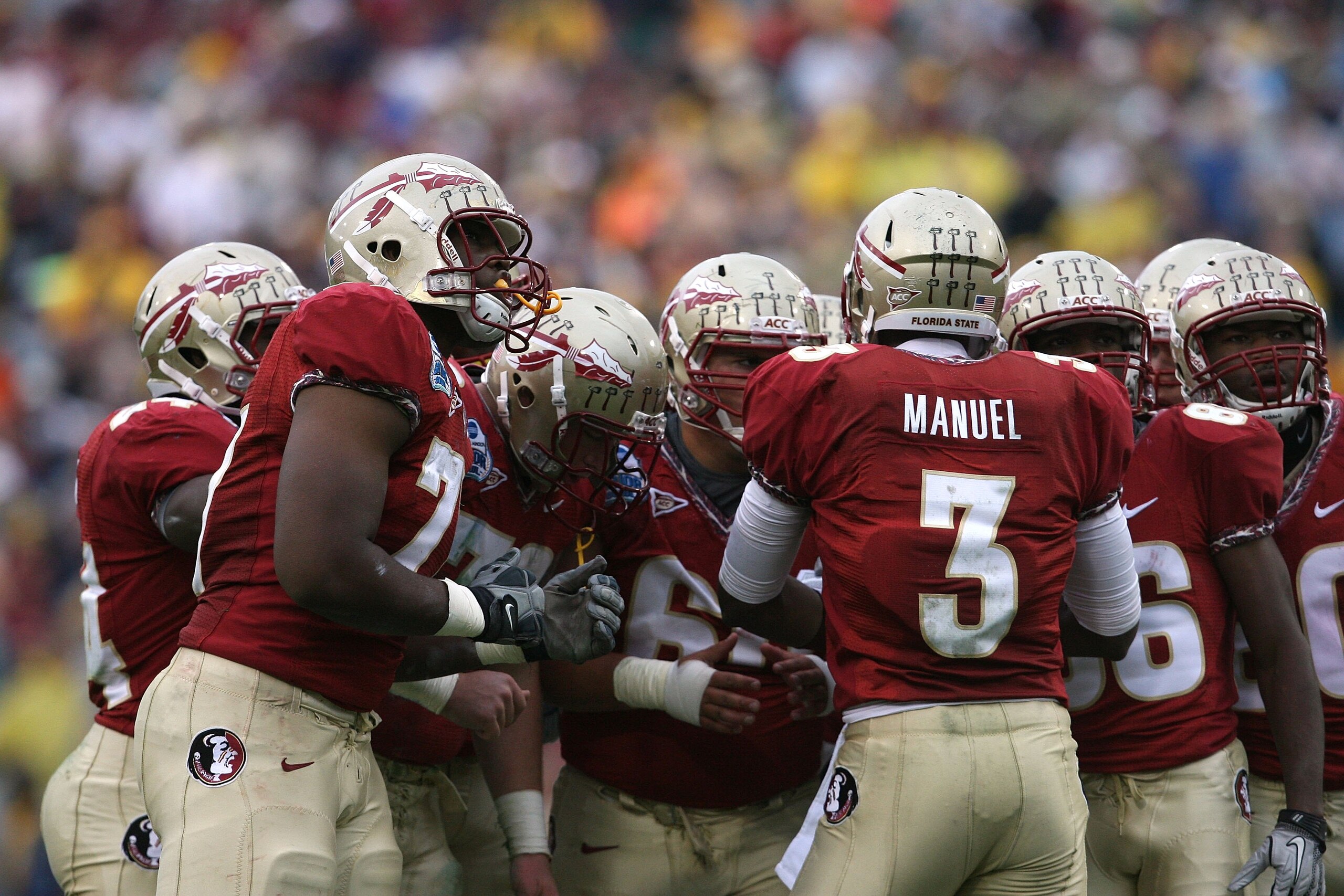 JACKSONVILLE, FL - JANUARY 01: Quarterback E.J. Manuel #3 of the Florida State Seminoles calls out a play in the huddle against the West Virginia Mountaineers during the Konica Minolta Gator Bowl on January 1, 2010 at Jacksonville Municipal Stadium in Ja JACKSONVILLE, FL - JANUARY 01: Quarterback E.J. Manuel #3 of the Florida State Seminoles calls out a play in the huddle against the West Virginia Mountaineers during the Konica Minolta Gator Bowl on January 1, 2010 at Jacksonville Municipal Stadium in Ja
