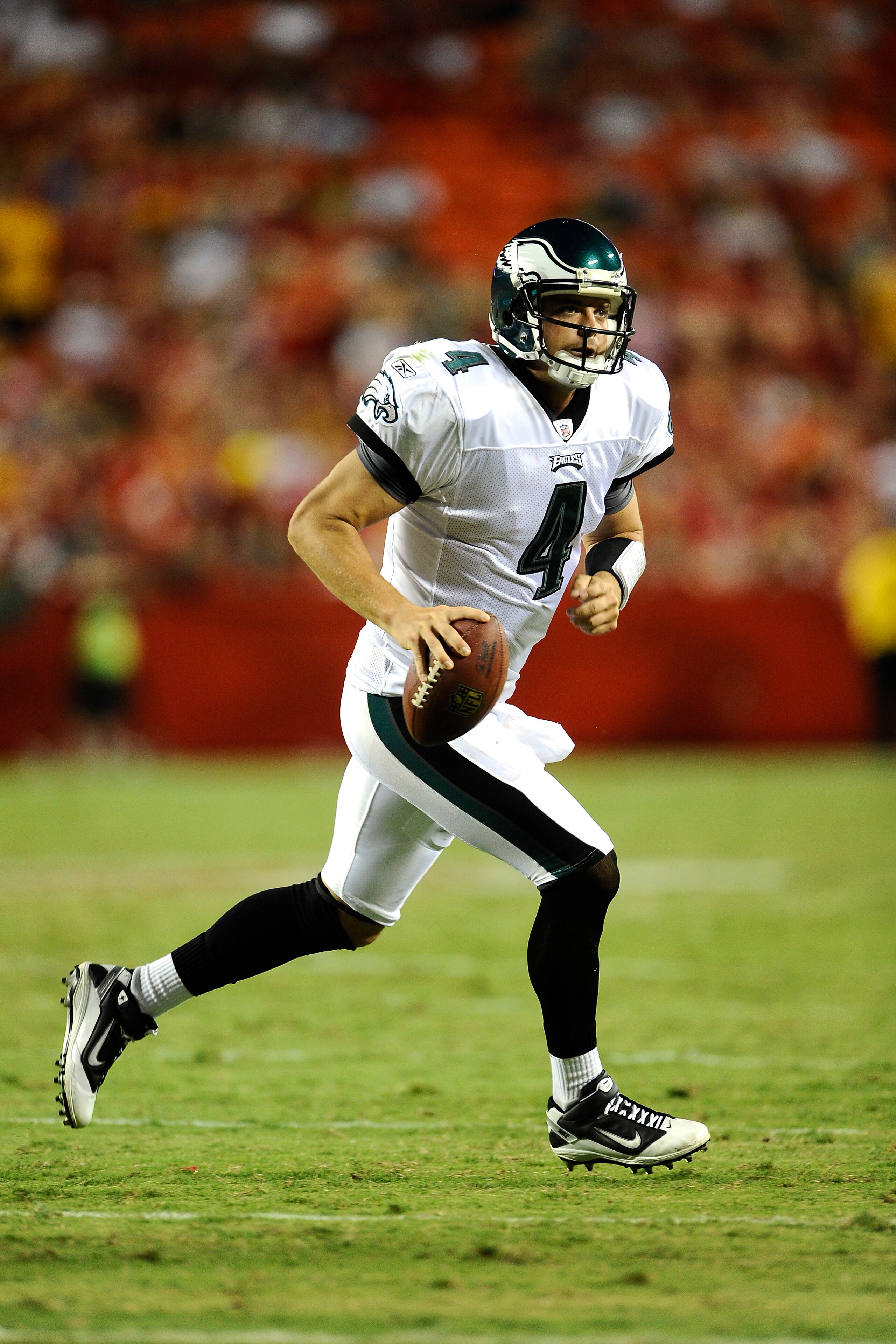 KANSAS CITY, MO - AUGUST 27: Kevin Kolb #4 of the Philadelphia Eagles looks to pass as he rolls out against the Kansas City Chiefs during a preseason game at Arrowhead Stadium on August 27, 2010 in Kansas City, Missouri.  (Photo by G. Newman Lowrance/Gett