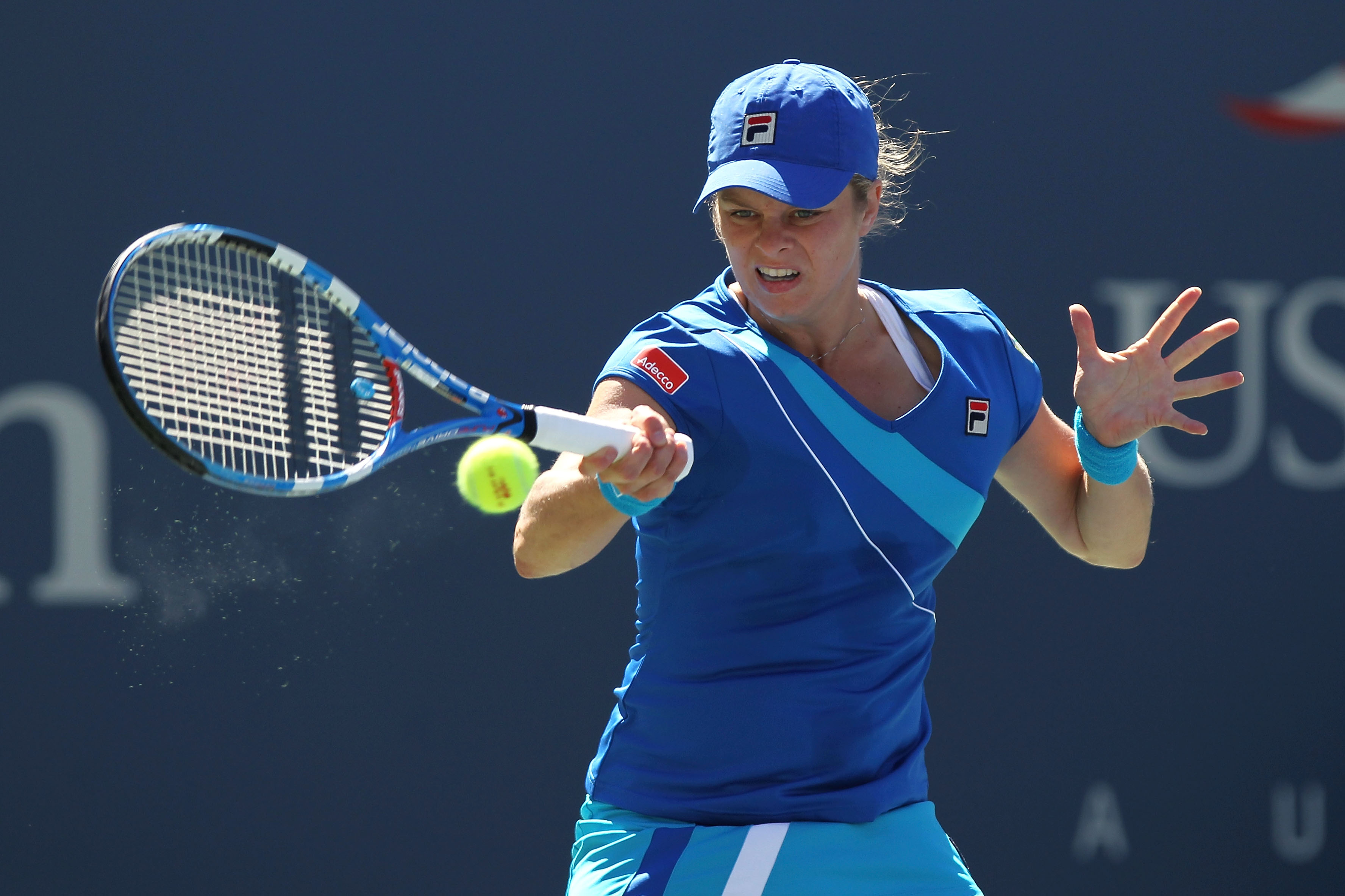 NEW YORK - SEPTEMBER 05:  Kim Clijsters of Belgium returns a shot against Ana Ivanovic of Serbia during her women's singles match on day seven of the 2010 U.S. Open at the USTA Billie Jean King National Tennis Center on September 5, 2010 in the Flushing n