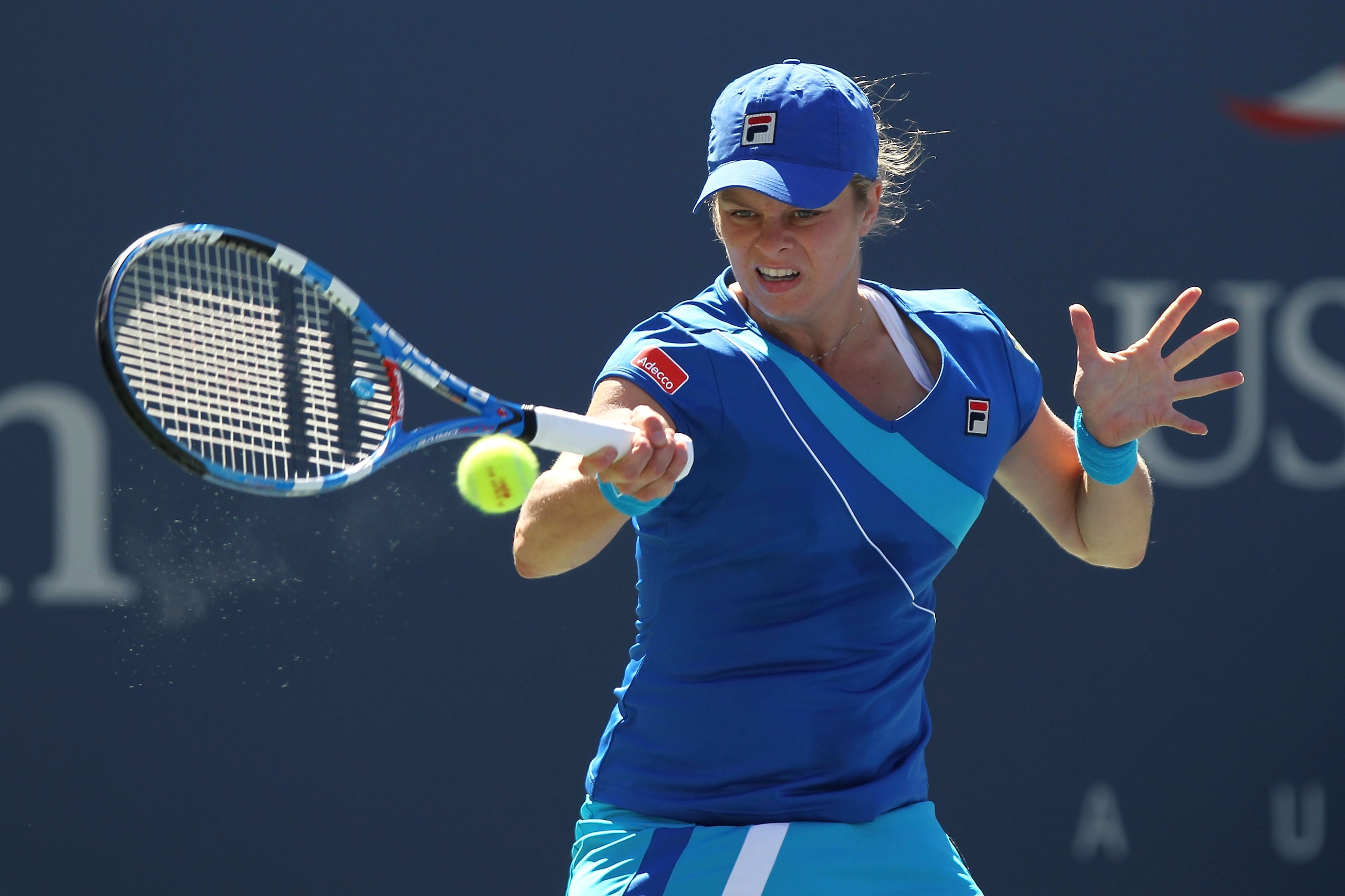 NEW YORK - SEPTEMBER 05:  Kim Clijsters of Belgium returns a shot against Ana Ivanovic of Serbia during her women's singles match on day seven of the 2010 U.S. Open at the USTA Billie Jean King National Tennis Center on September 5, 2010 in the Flushing n