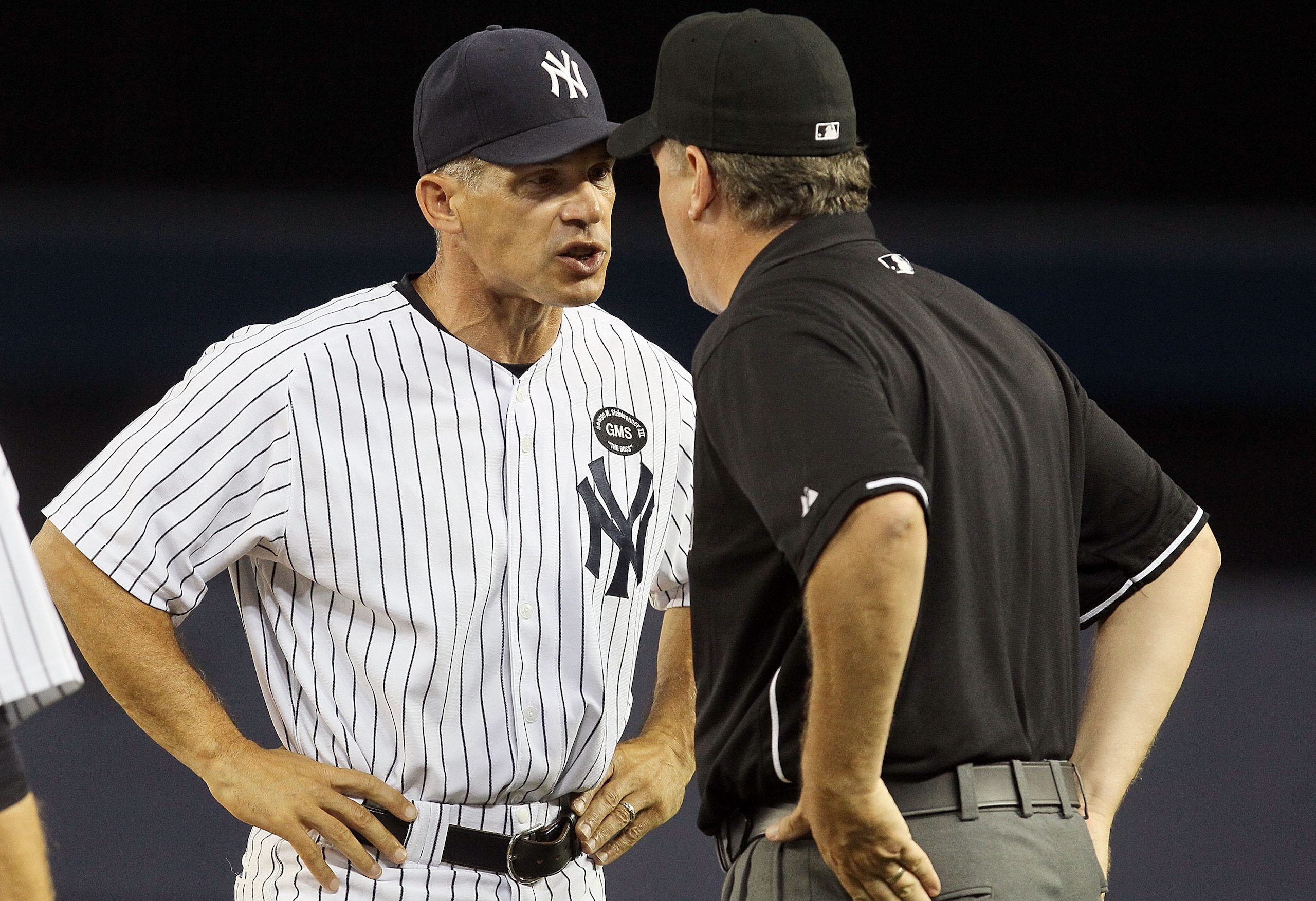 NEW YORK - JULY 20: Manager Joe Girardi #28 of the New York Yankees argues with first base umpire Paul Emmel during the sixth inning againast the Los Angeles Angels of Anaheim on July 20, 2010 at Yankee Stadium in the Bronx borough of New York City. Gira NEW YORK - JULY 20: Manager Joe Girardi #28 of the New York Yankees argues with first base umpire Paul Emmel during the sixth inning againast the Los Angeles Angels of Anaheim on July 20, 2010 at Yankee Stadium in the Bronx borough of New York City. Gira