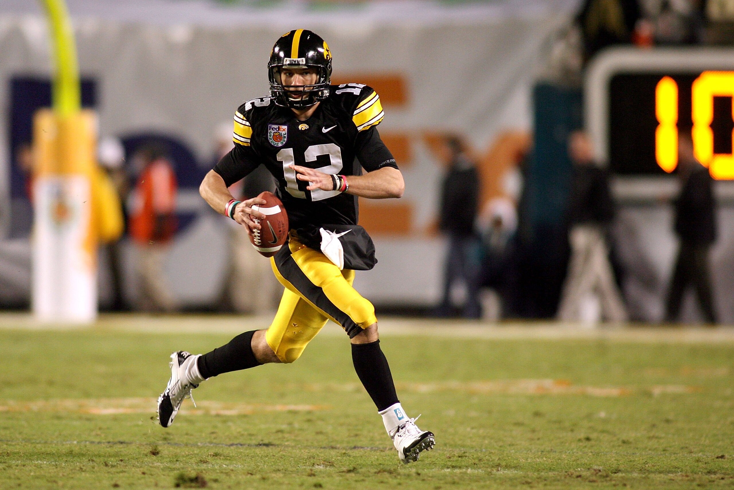 MIAMI GARDENS, FL - JANUARY 05: Quarterback Richy Stanzi #12 of the Iowa Hawkeyes rolls out of the pocket against the Georgia Tech Yellow Jackets during the FedEx Orange Bowl at Land Shark Stadium on January 5, 2010 in Miami Gardens, Florida. Iowa won 24 MIAMI GARDENS, FL - JANUARY 05: Quarterback Richy Stanzi #12 of the Iowa Hawkeyes rolls out of the pocket against the Georgia Tech Yellow Jackets during the FedEx Orange Bowl at Land Shark Stadium on January 5, 2010 in Miami Gardens, Florida. Iowa won 24