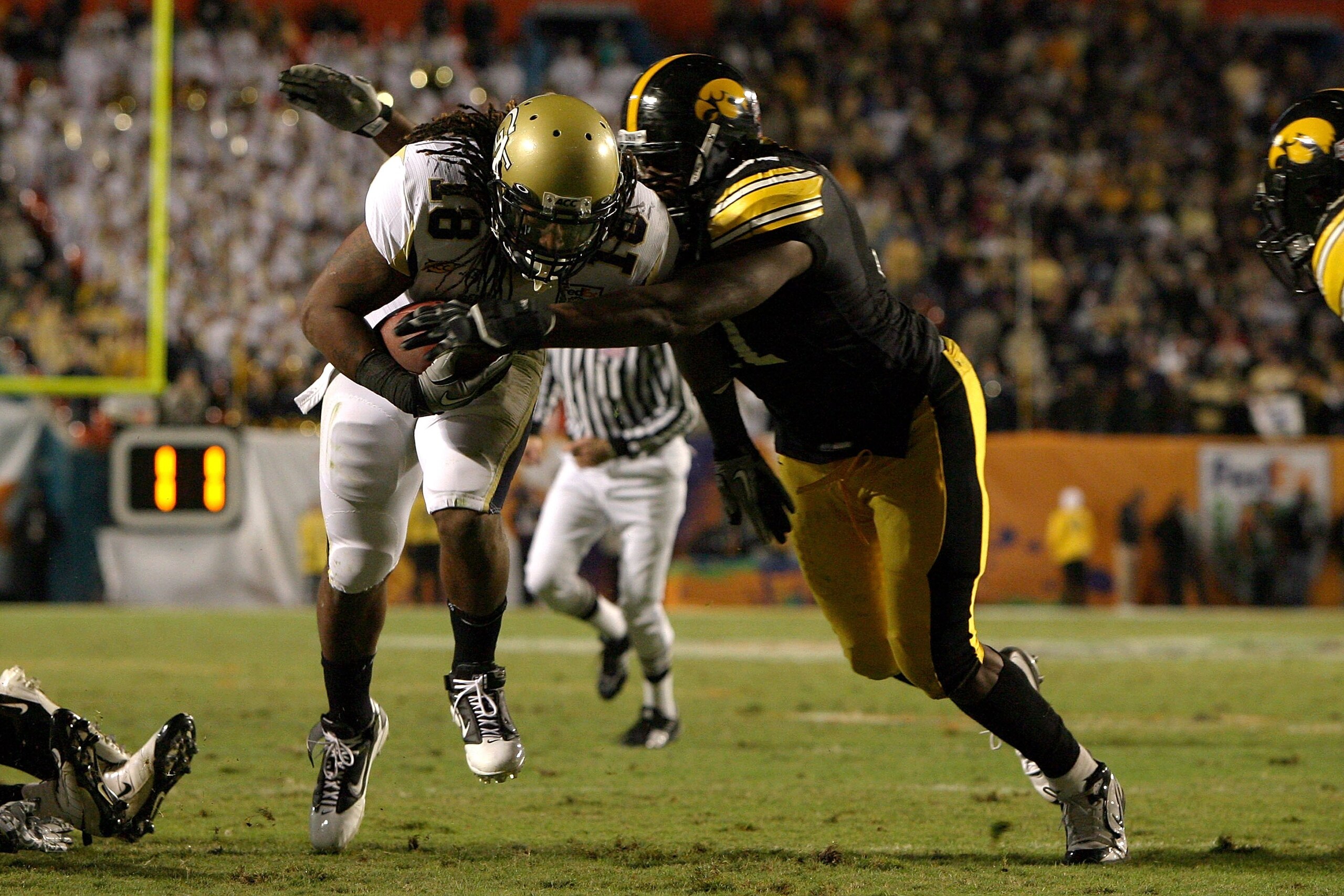 MIAMI GARDENS, FL - JANUARY 05: Anthony Allen #18 of the Georgia Tech Yellow Jackets runs with the ball against the Iowa Hawkeyes during the FedEx Orange Bowl at Land Shark Stadium on January 5, 2010 in Miami Gardens, Florida. Iowa won 24-14. (Photo by D MIAMI GARDENS, FL - JANUARY 05: Anthony Allen #18 of the Georgia Tech Yellow Jackets runs with the ball against the Iowa Hawkeyes during the FedEx Orange Bowl at Land Shark Stadium on January 5, 2010 in Miami Gardens, Florida. Iowa won 24-14. (Photo by D