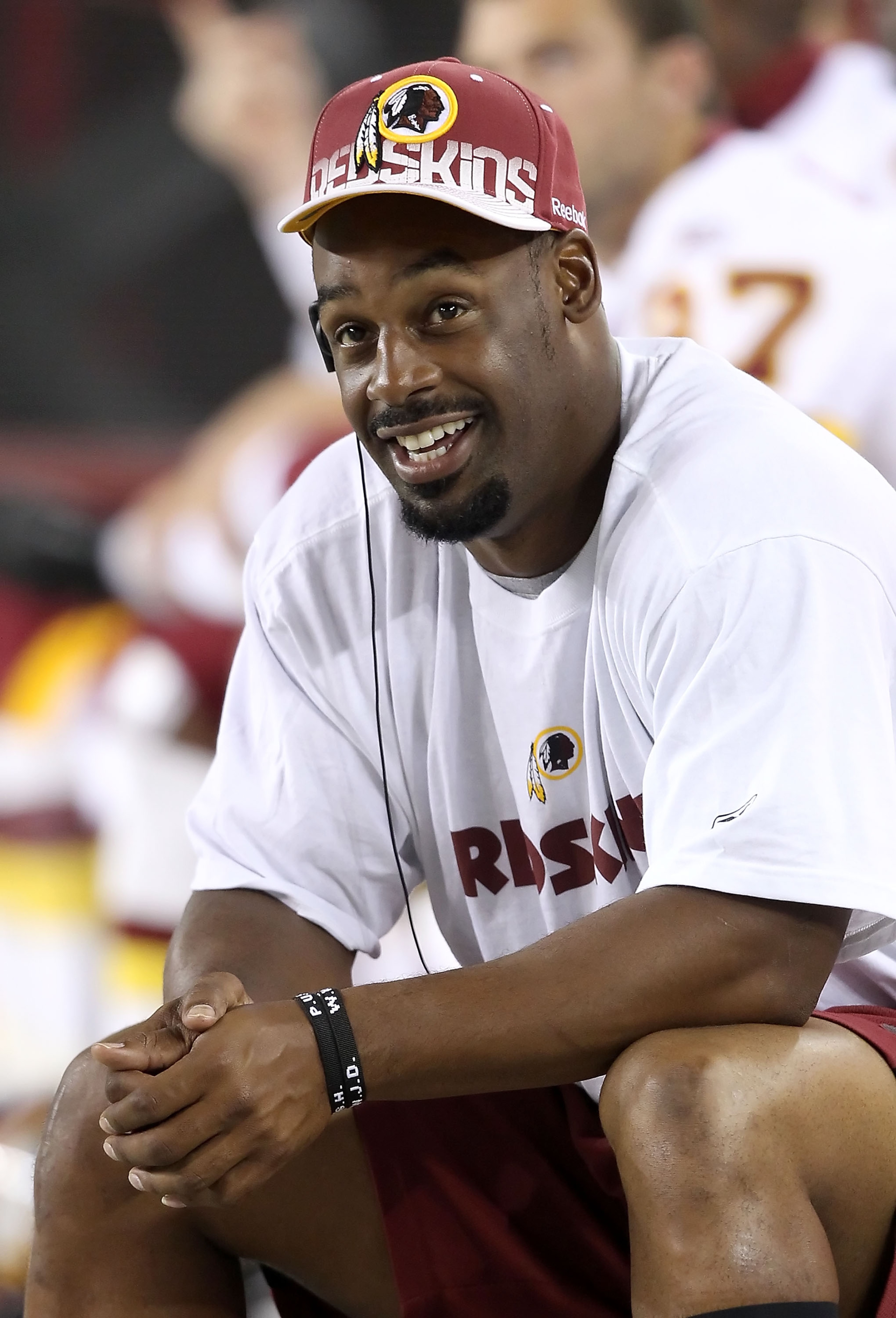 GLENDALE, AZ - SEPTEMBER 02:  Quarterback Donovan McNabb #5 of the Washington Redskins sits on the sidelines during preseason NFL game against the Arizona Cardinals at the University of Phoenix Stadium on September 2, 2010 in Glendale, Arizona.  The Cardi