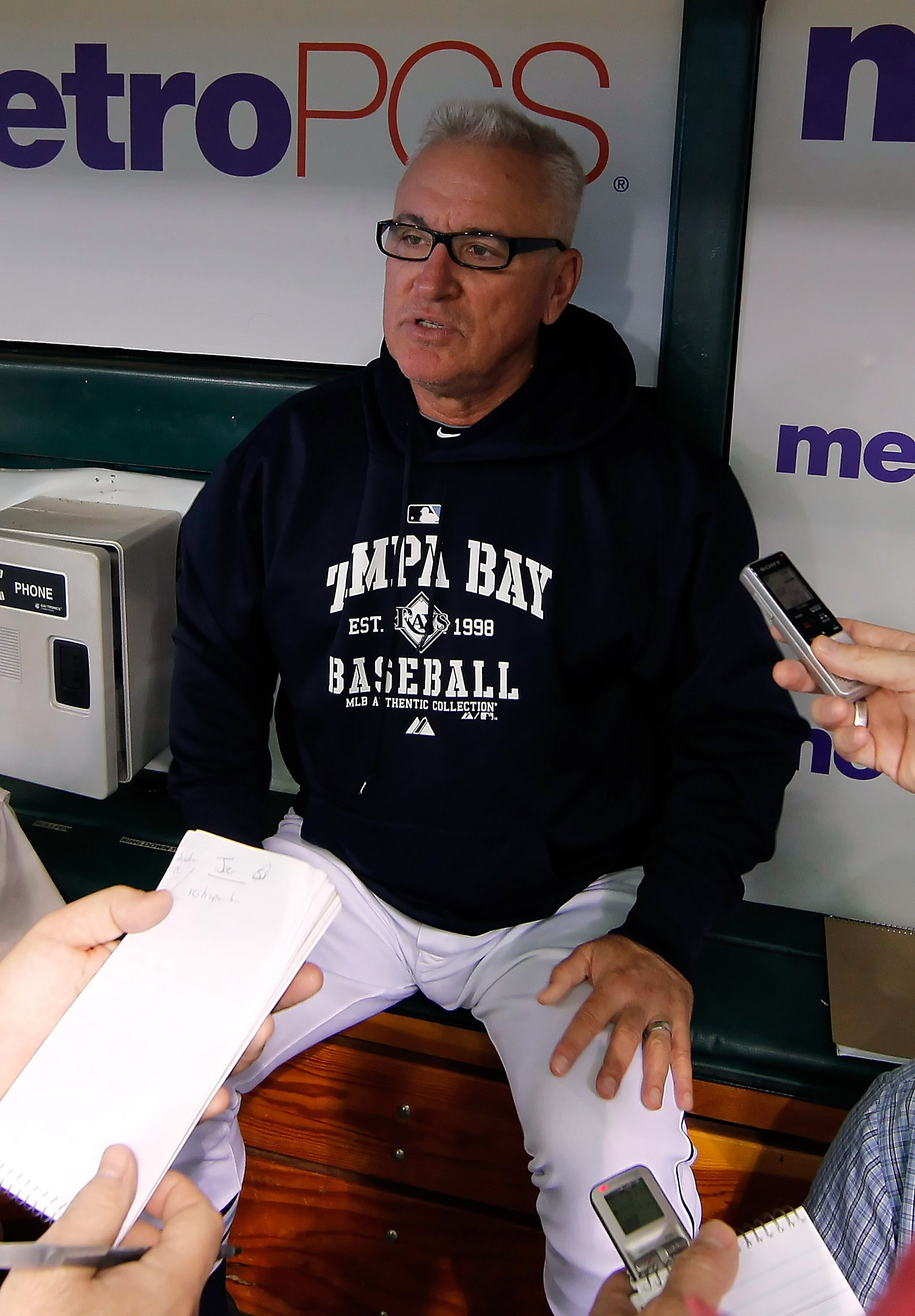 ST. PETERSBURG - JULY 11:  Manager Joe Maddon #70 of the Tampa Bay Rays talks with reporters just before the start of the game against the Cleveland Indians at Tropicana Field on July 11, 2010 in St. Petersburg, Florida.  (Photo by J. Meric/Getty Images)