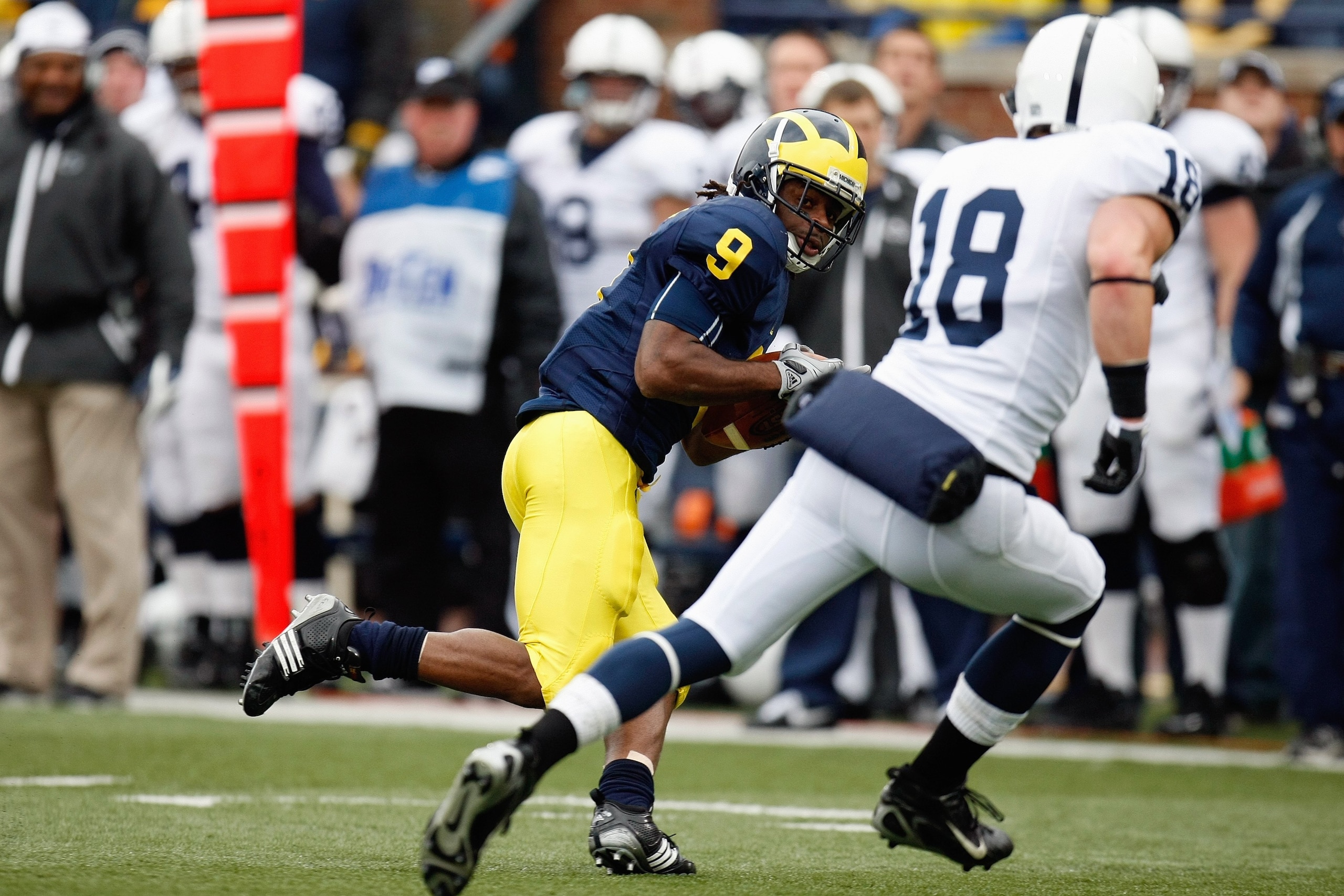 ANN ARBOR, MI - OCTOBER 24:  Martavious Odoms #9 of the Michigan Wolverines carries the ball against Nick Sukay #18 of the Penn State Nittany Lions on October 24, 2009 at Michigan Stadium in Ann Arbor, Michigan. (Photo by  Gregory Shamus/Getty Images)